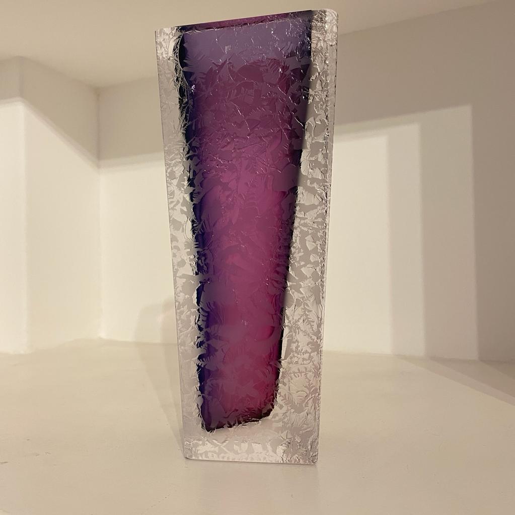 This vase strikes a balance between bold and delicate beauty, with its captivating, vibrant purple hue. Perfect to elevate your space with modern charm and a touch of elegance.