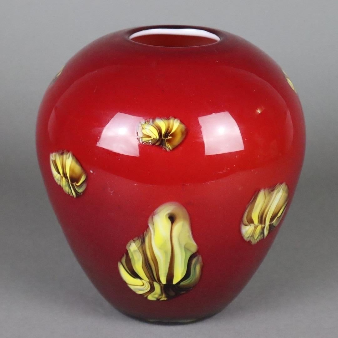Beautiful red coloured glass vase with embedded applications in yellow and brown. Overlayed glass, inside opaque white. Base with tear-off. Ca 20 cm. Unknown design and maker. Probably Germany in the 1960s
 