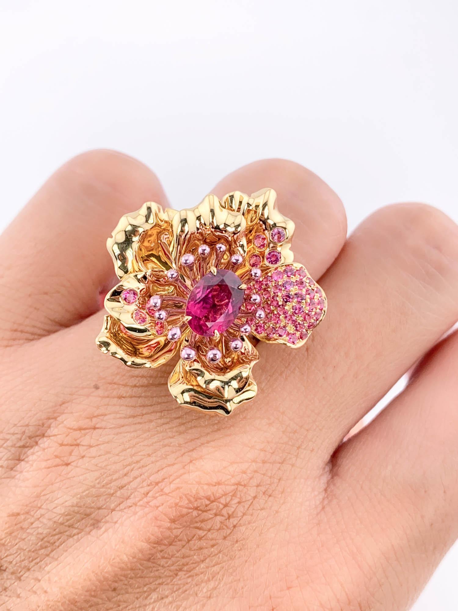 Distinctive and luxurious, this one-of-a-kind art jewelry from our Nature Collection will be the centerpiece of your ensemble. Boasting a masterfully crafted flower design draped in a 18K gold floral setting studded with hot pink spinels, the ring