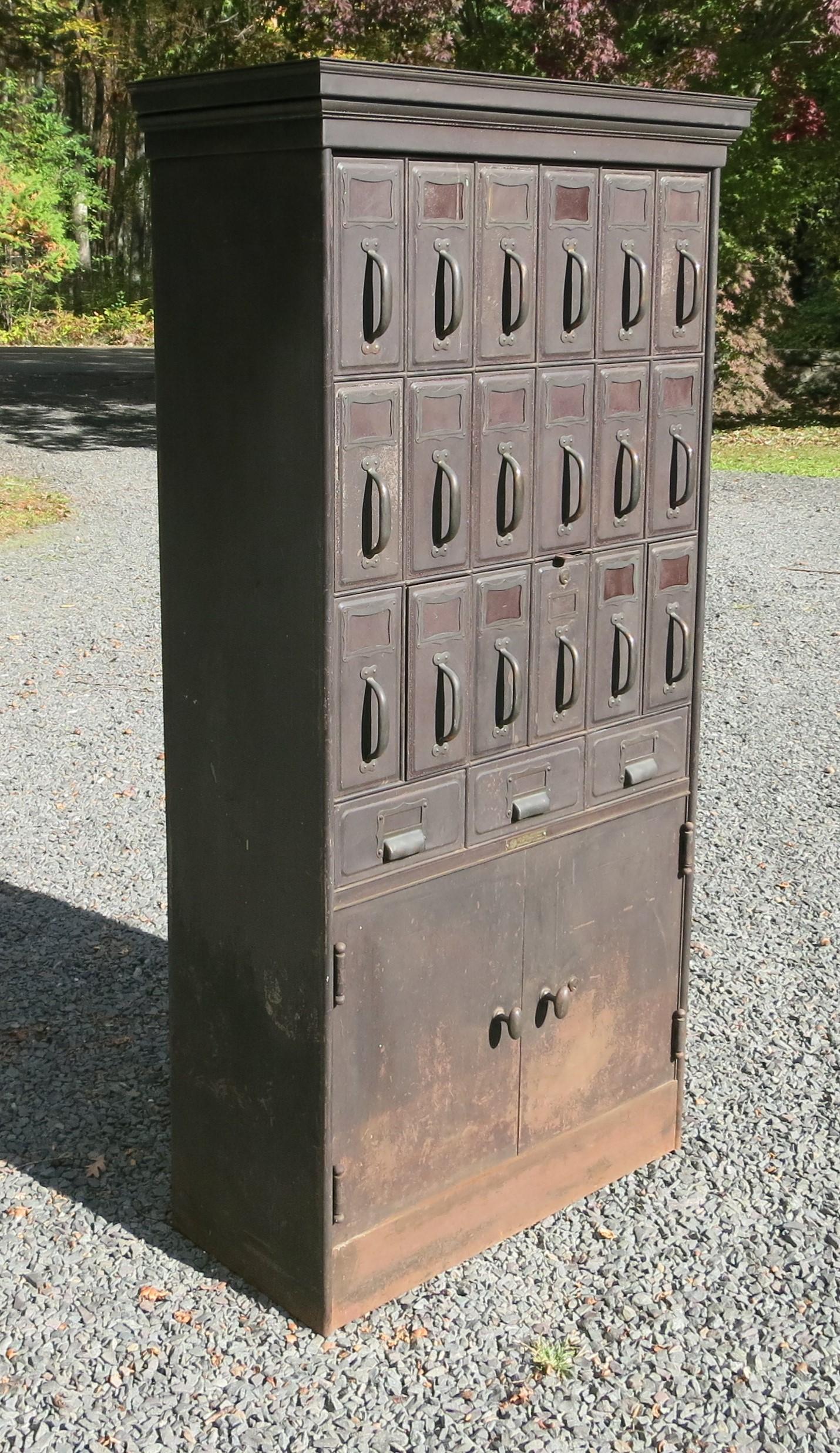 Very heavy well-made Art Metal Construction Company filing cabinet in distressed original paint. Paint loss and rust near the bottom of the cabinet. It is 14.75