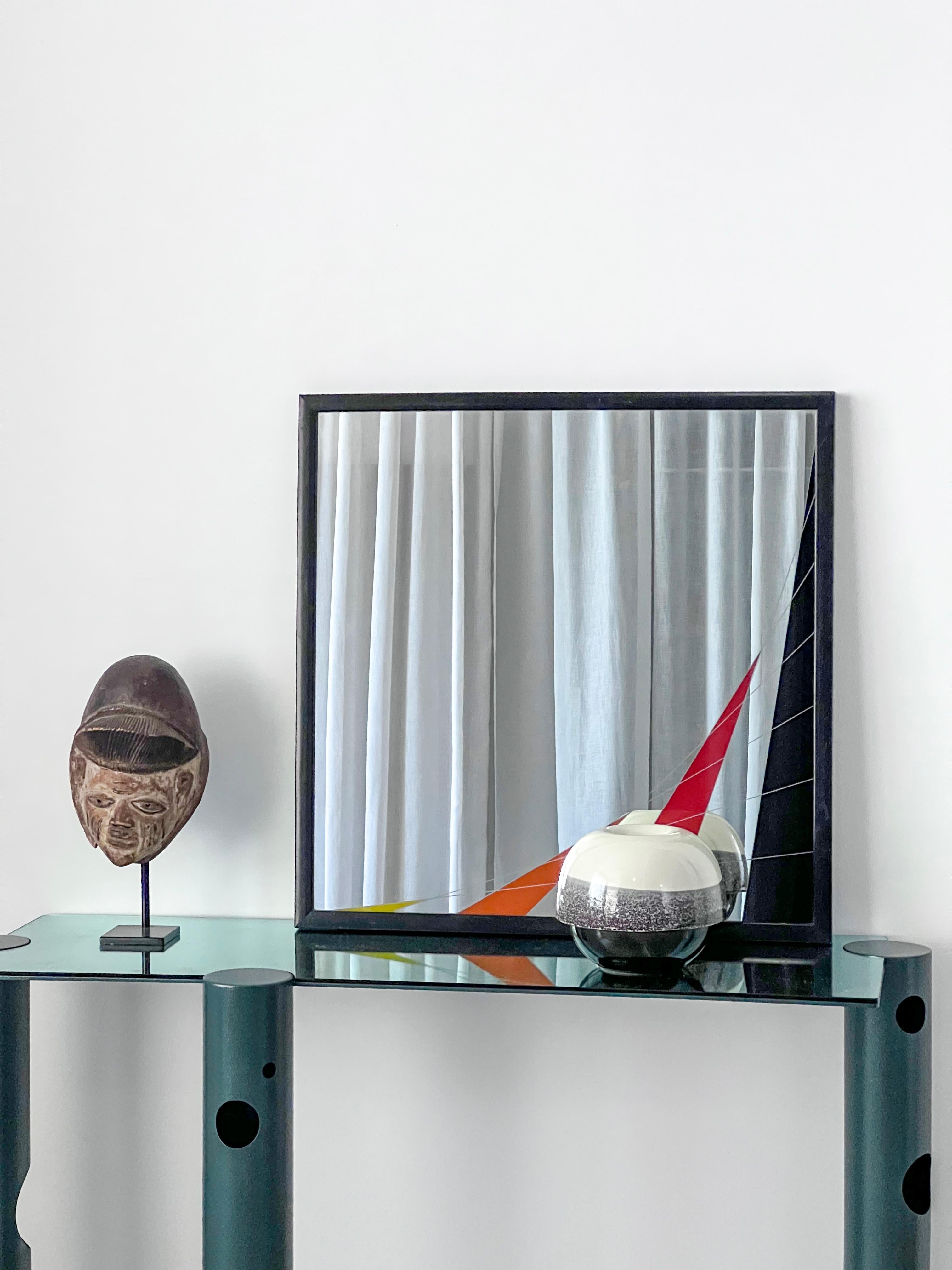 Decorative wall mirror designed by Italian artist Eugenio Carmi in his signature style of geometric, colorful decoration, typical on the 1980s and specifically of the 