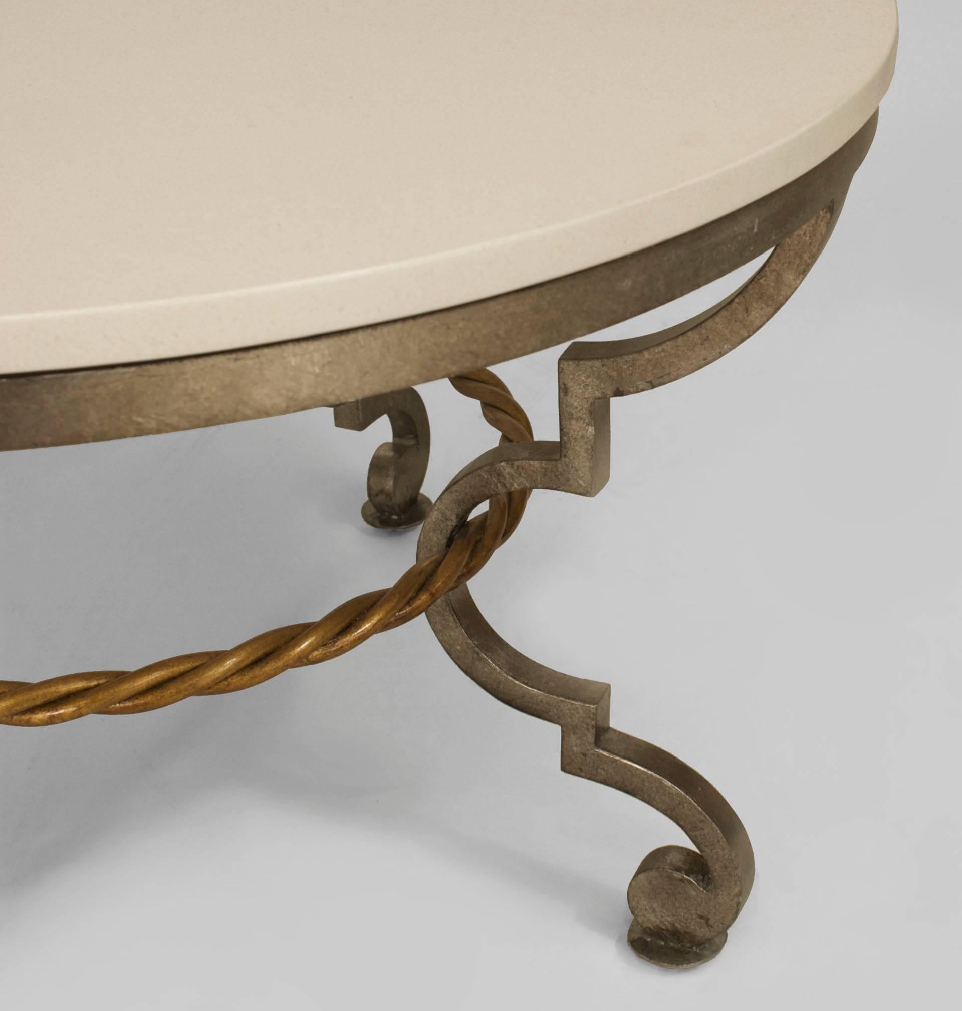 French Art Moderne-style round coffee table with a silver patinated bronze base with a gilt rope design stretcher supporting a limestone top.
