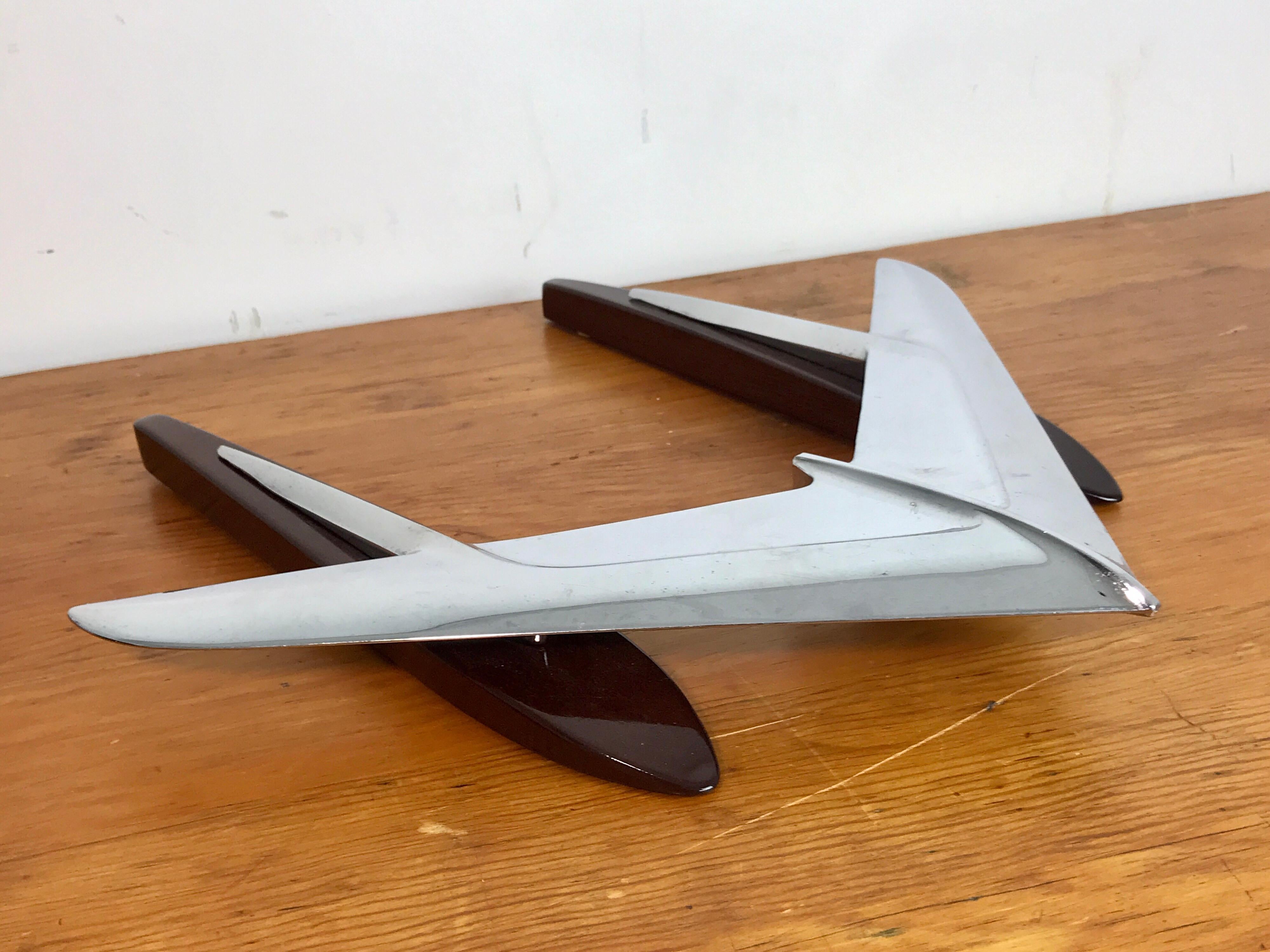 Art Moderne airplane sculpture, 1950s, raised on a French polished hardwood base.