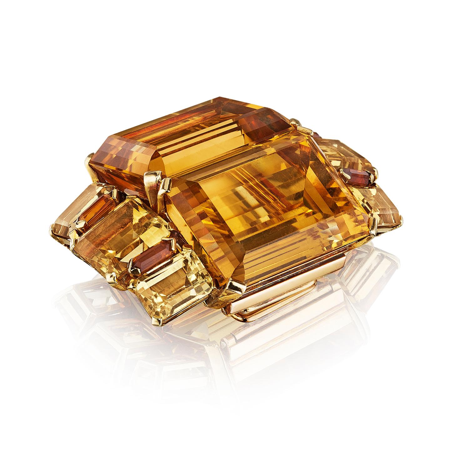 Art Moderne Citrine Brooch by Suzanne Belperron for René Boivin, Paris, 1933
A brooch composed of step-cut and baguette-cut citrines; mounted in gold, with French assay marks
• 12 step-cut and baguette citrines 
• Maker’s mark for René Boivin 
•