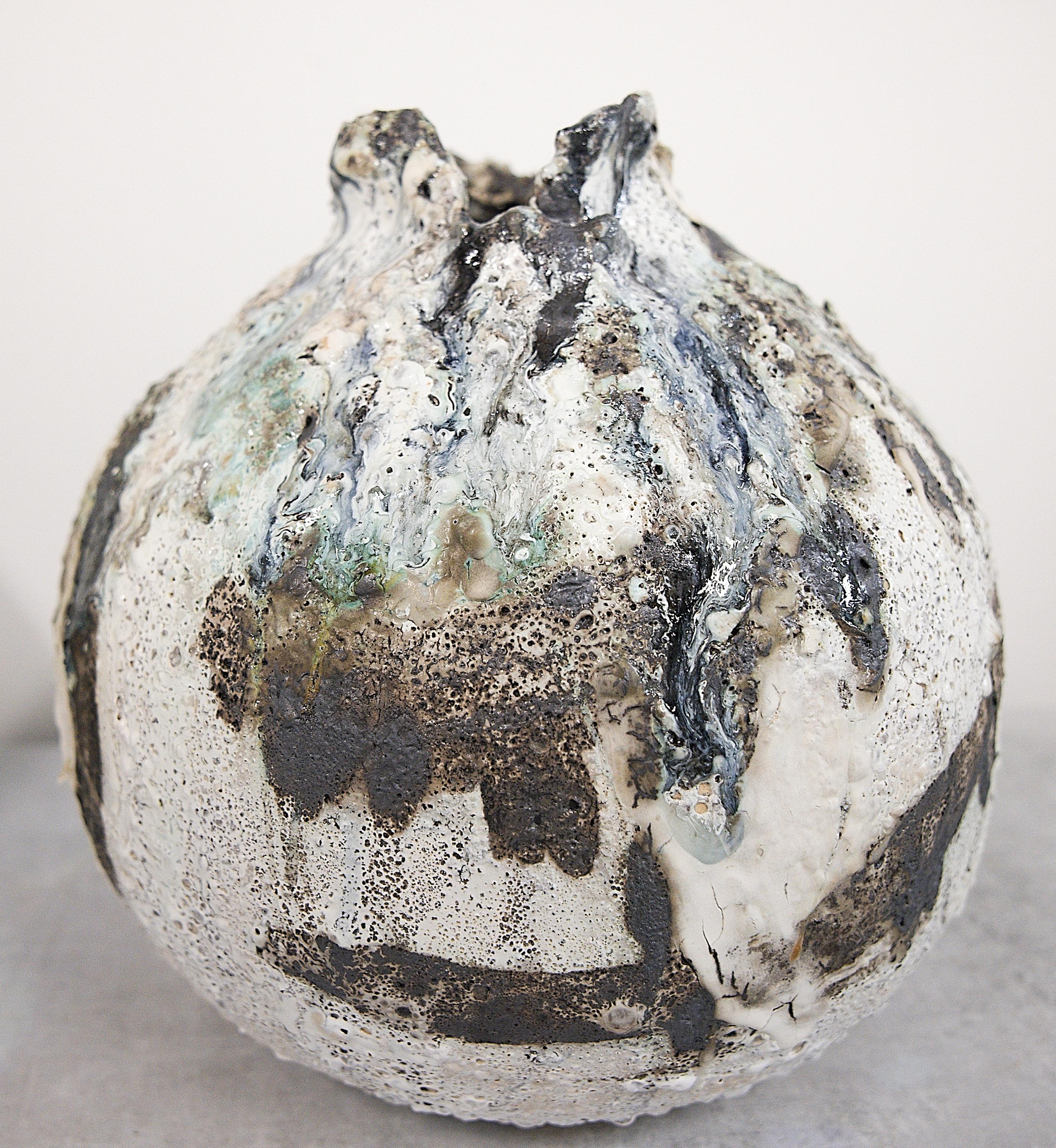 These one of Kind Moon Vases are created using oxides, glaze, slips and multiple firings

 

12x12 torn rim moon
crackle exterior will suggest careful handling of vase 
dust and hand wash
please test for water 
and protect furniture with