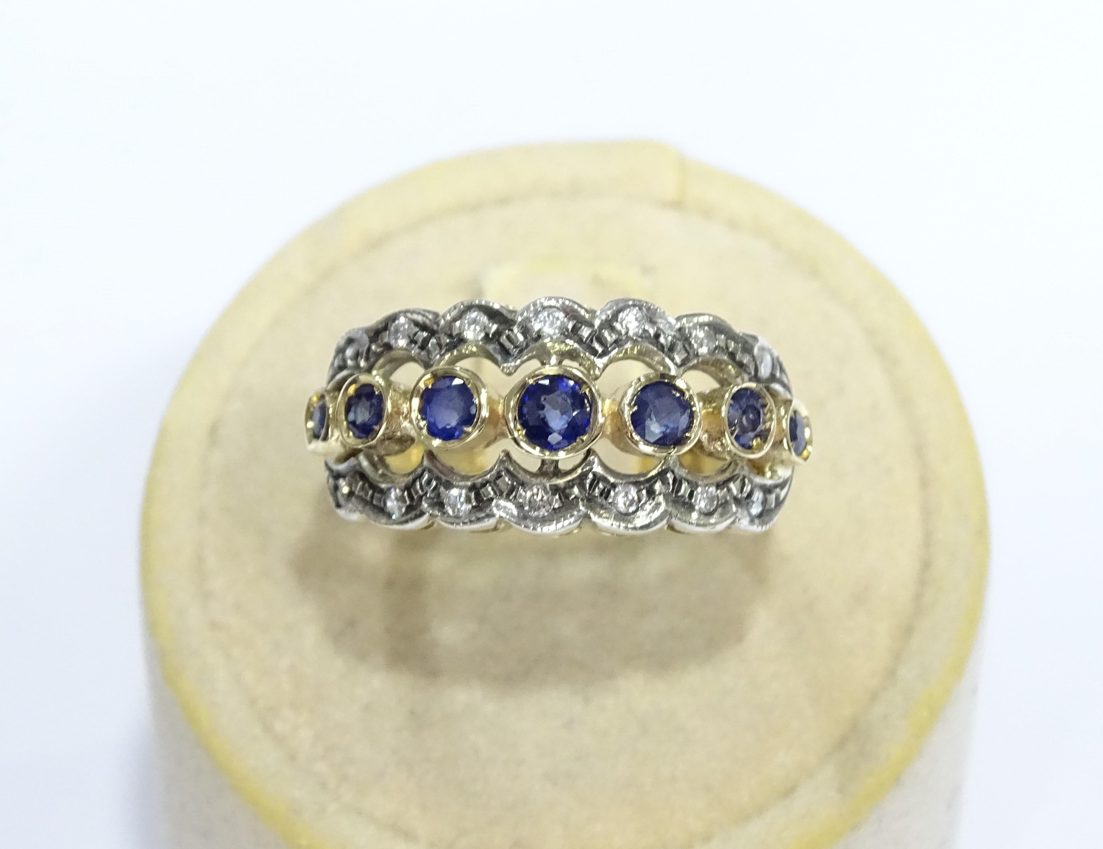 This Ring is made of 14K Yellow Gold and Sterling Silver.
This Ring has 0.14 Carats of Round Cut White Diamonds.
This Ring has 0.80 Carats of Sapphires.
This Ring is also available, on request, with Rubies or Emeralds.
This Ring is inspired by Art