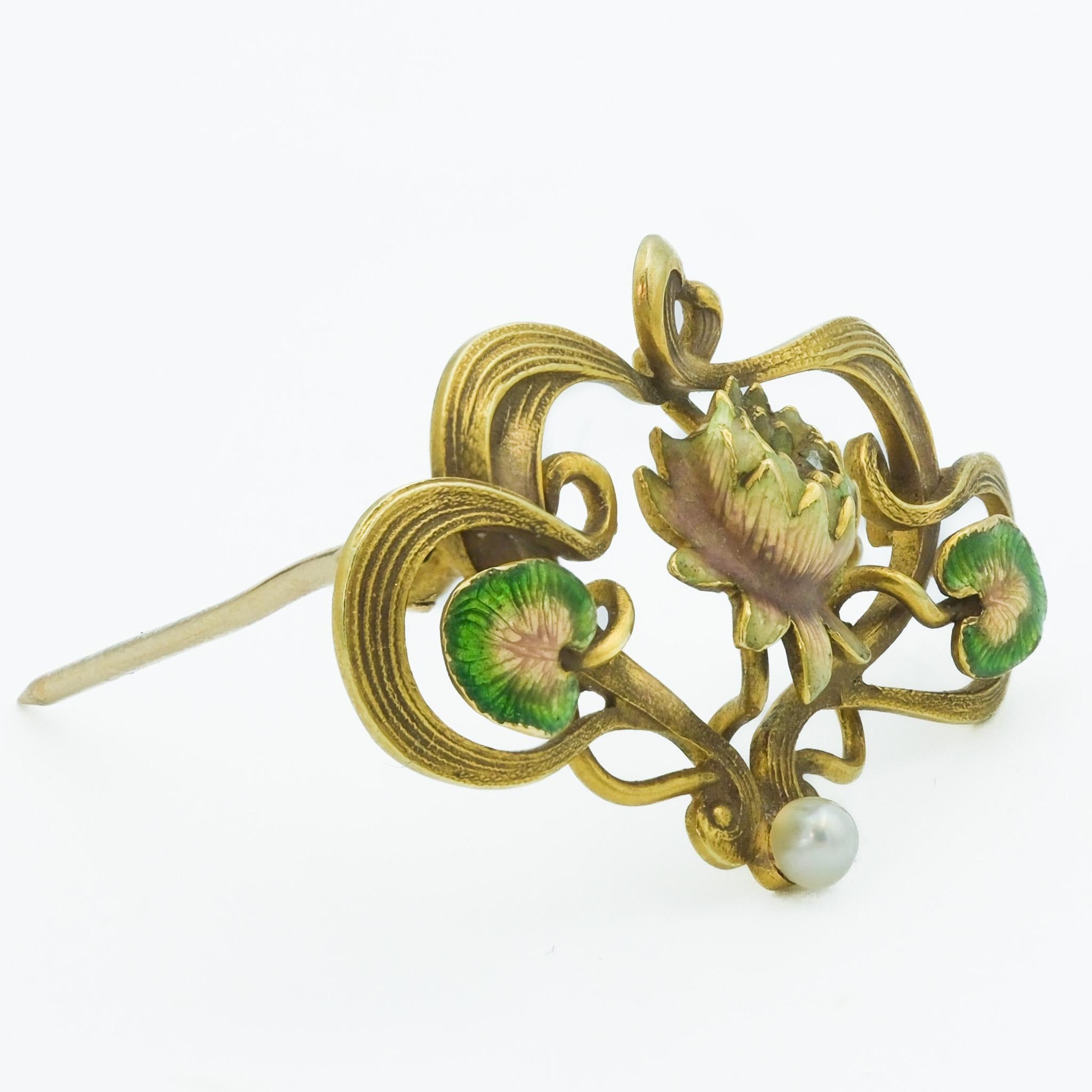 This 10 karat yellow gold brooch pin from the Art Nouveau era, features a stylized floral design that is characteristic of the period - spanned roughly from 1890 to 1910. Art Nouveau was a reaction against the academic art, industrialization, and