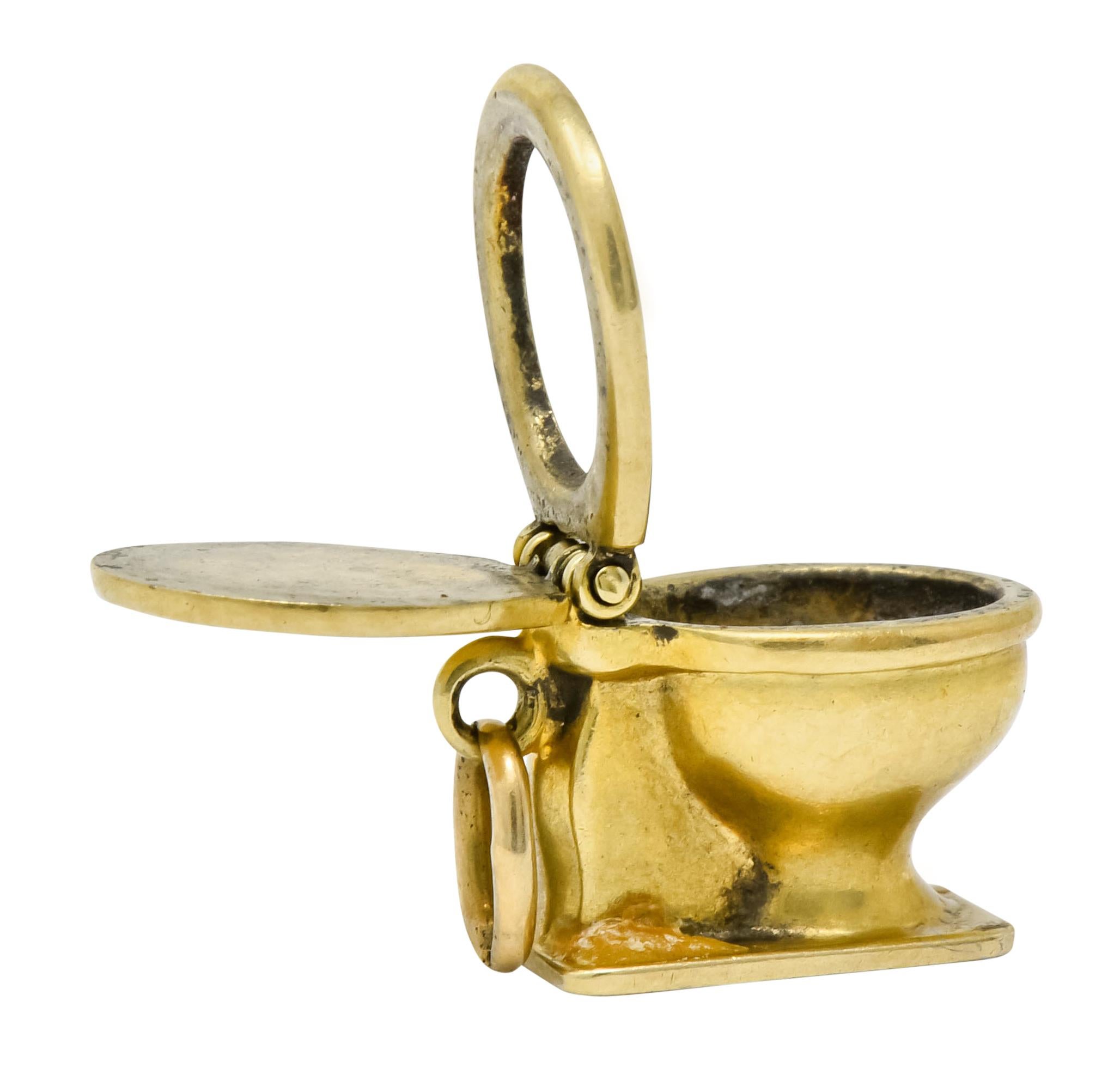 Charm designed as a polished gold toilet bowl with an articulated lid and seat

Completed by jump ring bale

Tested as 14 karat gold with makers mark

Circa: 1900s

Measures: approximately 1/2 x 3/8 inch

Total weight: 3.2 grams

Lighthearted.