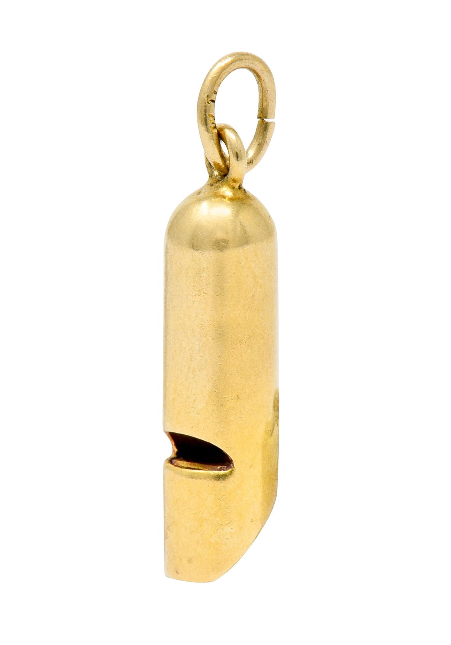Designed as an elongated and streamlined whistle with a bright polish

Tapered at end as a mouthpiece and with pierced air escape

Functional with a modest high pitched whistle

Stamped 14K for 14 karat gold

Circa: 1905

Measures: 1/4 x 7/8 inch