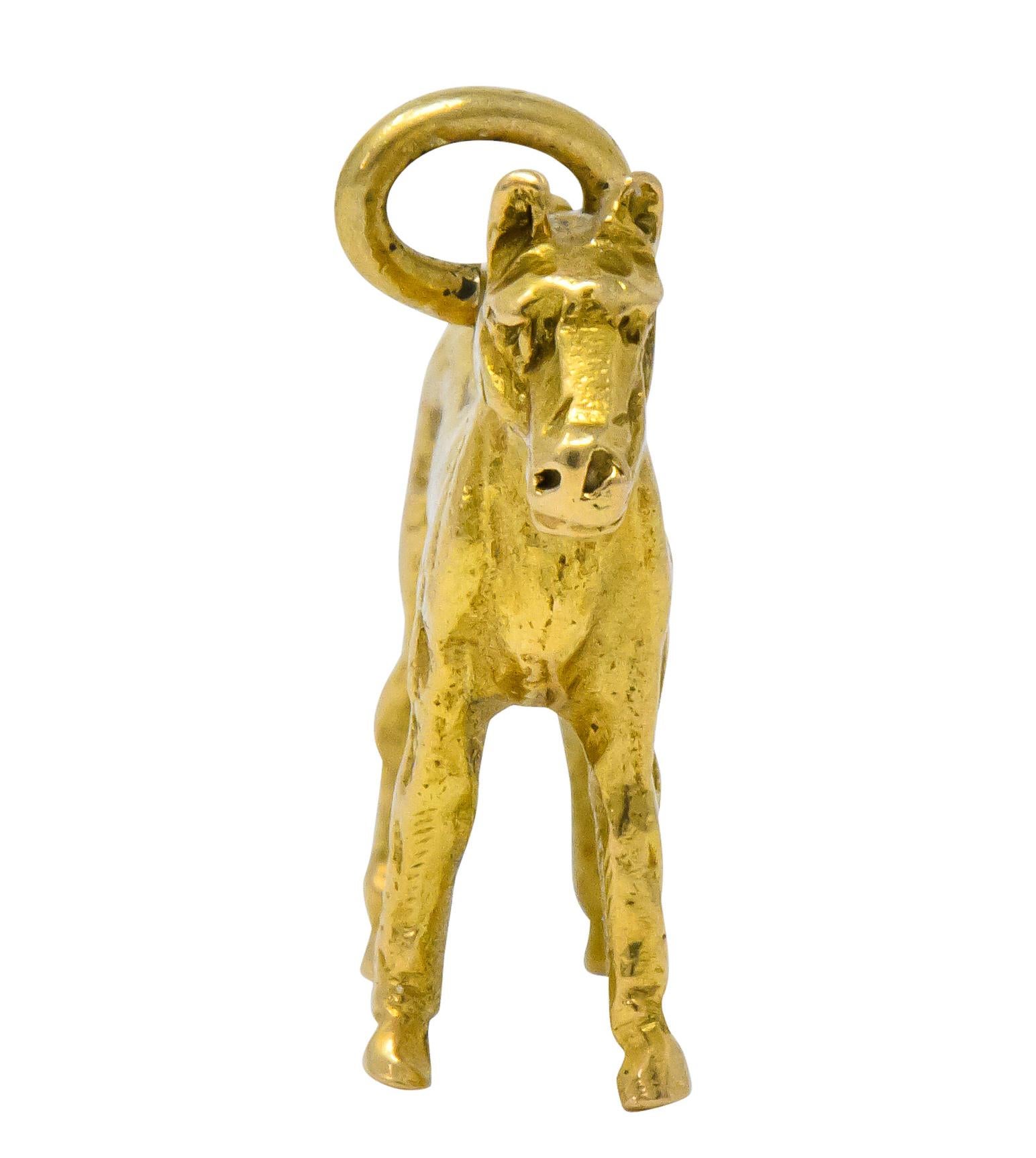 Horse charm stoically standing and looking forward

Textured detailing of face, mane, and hooves

Stamped 14 for 14 karat gold

Measures: approx. 7/8 x 3/4 (including bale) inch

Circa 1910

Total weight: 3.2 grams

Proud. Natural. Equine.


