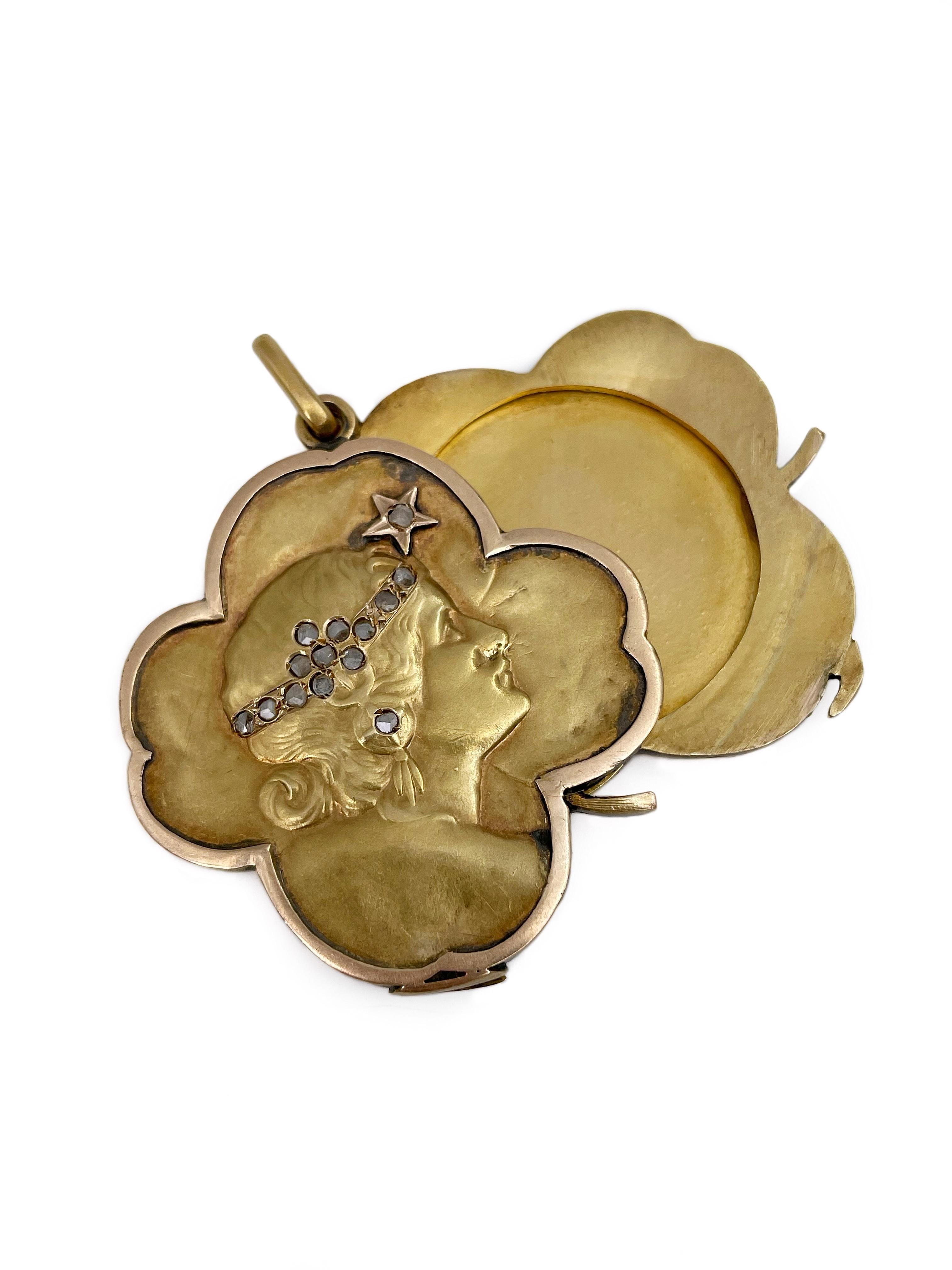 This is an amazing Art Nouveau locket pendant in a shape of a four-leaf clover. The piece is crafted in 14K yellow gold. It depicts a glamorous lady with a hairband and an earring encrusted with 14 rose cut diamonds.

It has some minor scratches.