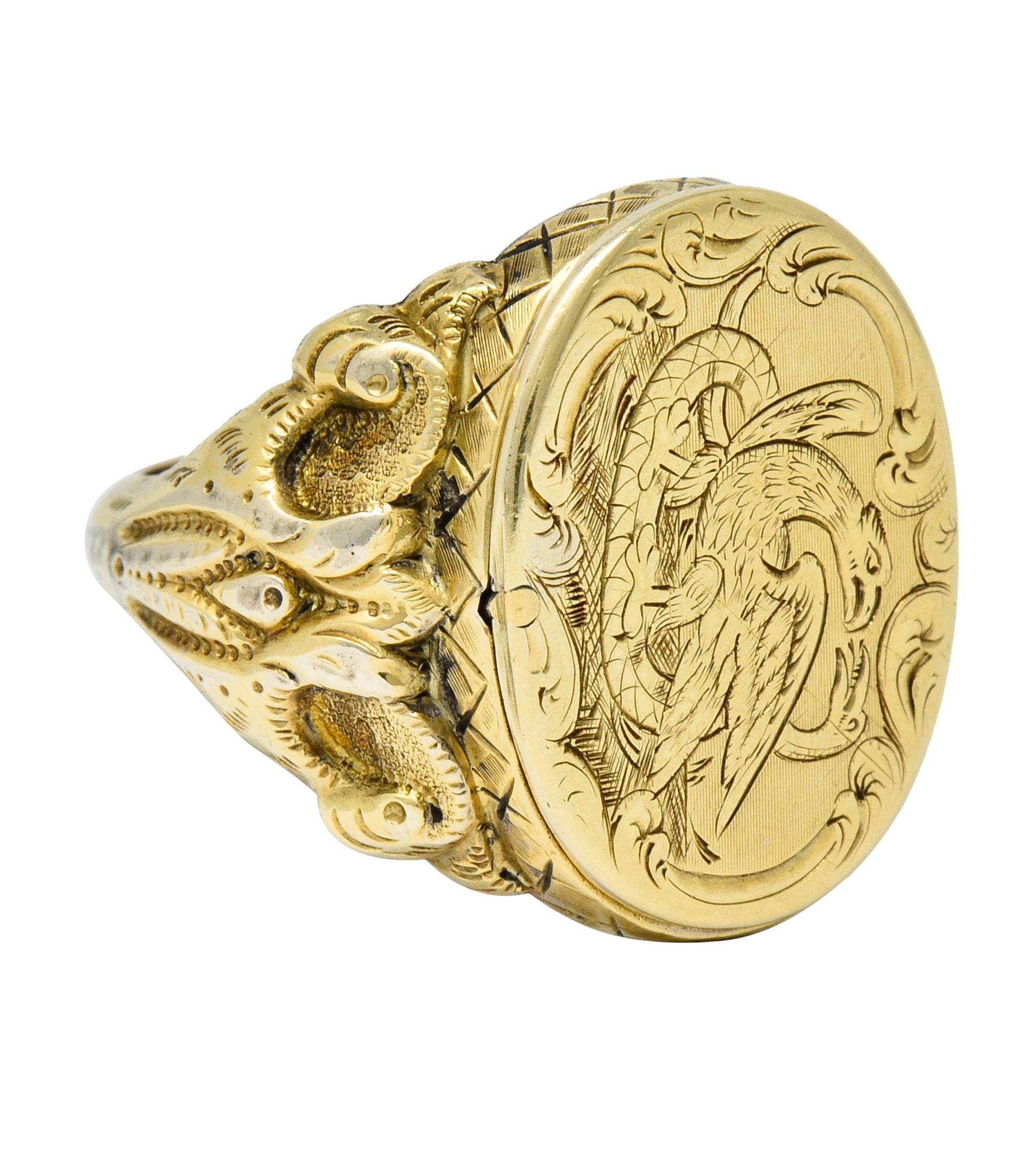 Signet style ring with a deeply engraved oval face

Depicting a stylized eagle with spread wings trampling a vicious snake

Neoclassical and symbolic indicative of good triumphing evil with the eagle strongly associated to divine justice

Image is