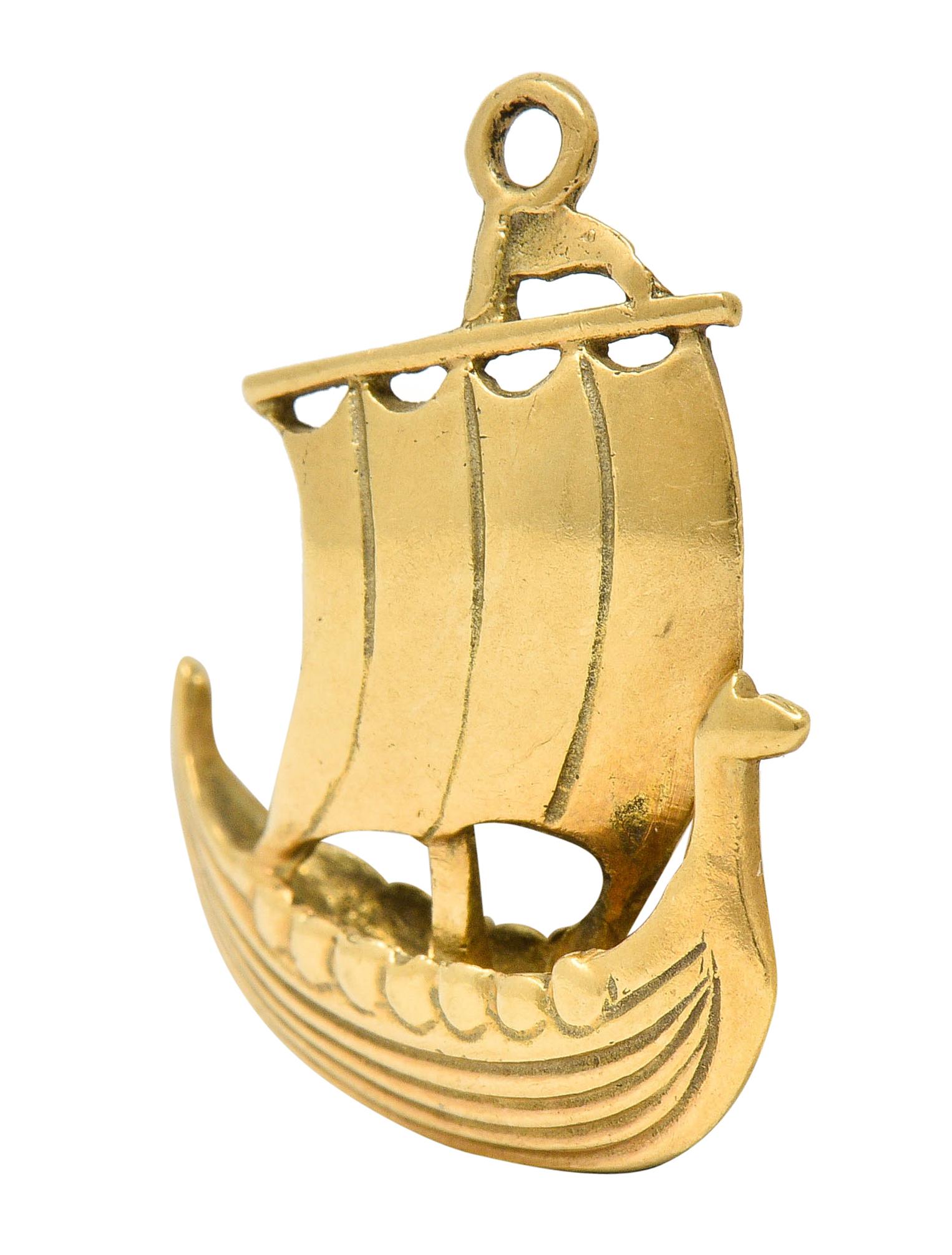 Designed as a stylized Viking longboat

With a billowing sail and ribbed texture

Maker's mark and stamped for 14 karat gold

Circa: 1905

Measures: 3/4 x 7/8 inch

Total weight: 2.6 grams

Gliding. Sailing. Pioneer.
 

Stock Number: We-5365