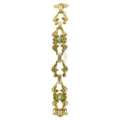 Antique Art Nouveau 14 Karat Yellow Gold Scroll Work and Green Gemstone Link Bracelet