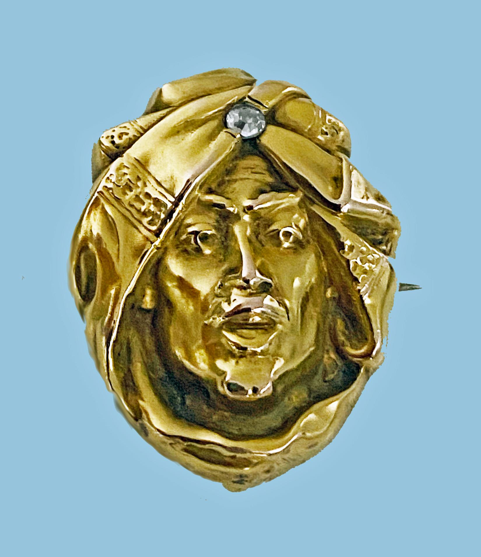 Art Nouveau 14K and Diamond Brooch, C.1900. Depicting a three dimensional profile with turban headdress inset with small old mine cut diamond. Pin and hook fitment to reverse that was used to attach a locket, charm or jewel or watch. Measures: 1.00