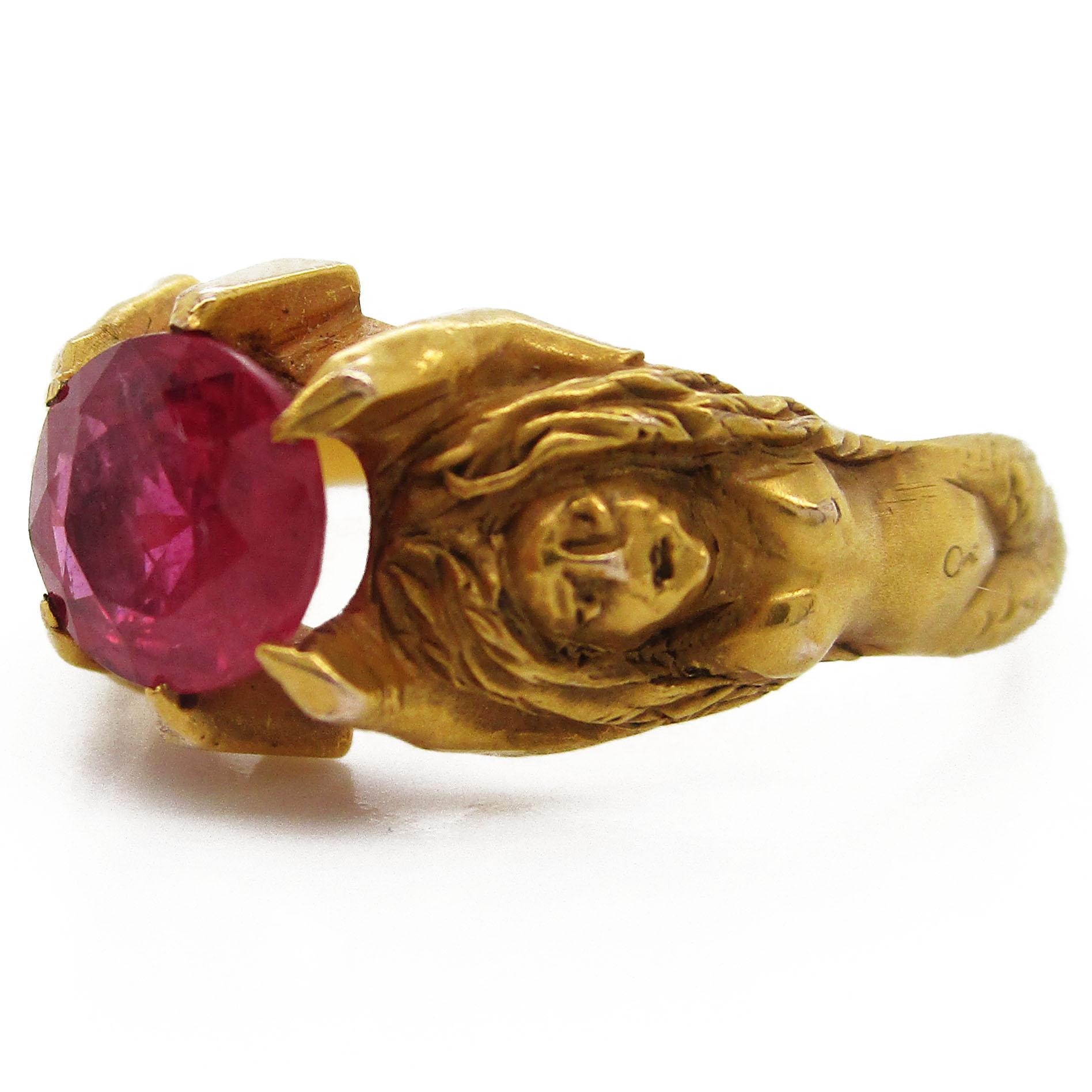 This gorgeous all original antique Art Nouveau ring dates back to 1890 and is full of timeless, classic beauty! The ring is solid 14 karat yellow gold with an incredibly detailed depiction of two mermaids with their arms raised. Their outstretched