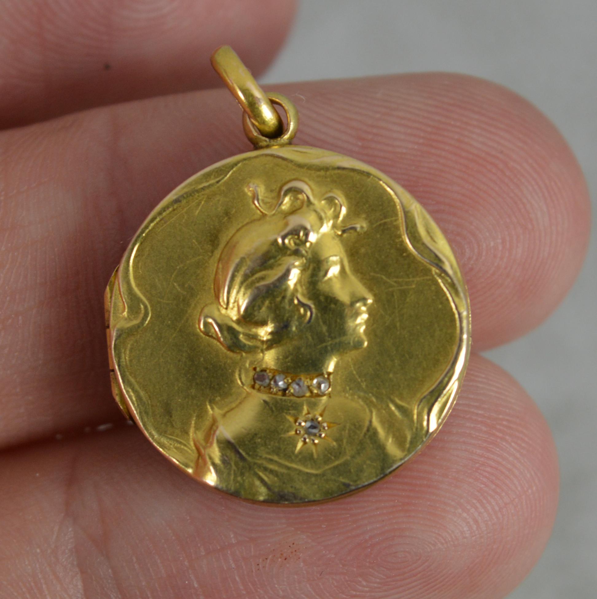 A stunning Edwardian era pendant or locket.
Solid 15 carat yellow gold example.
Circular example with a female bust to centre set with four rose cut diamonds creating a necklace and a further diamond below creating a star pendant.

CONDITION ; Very