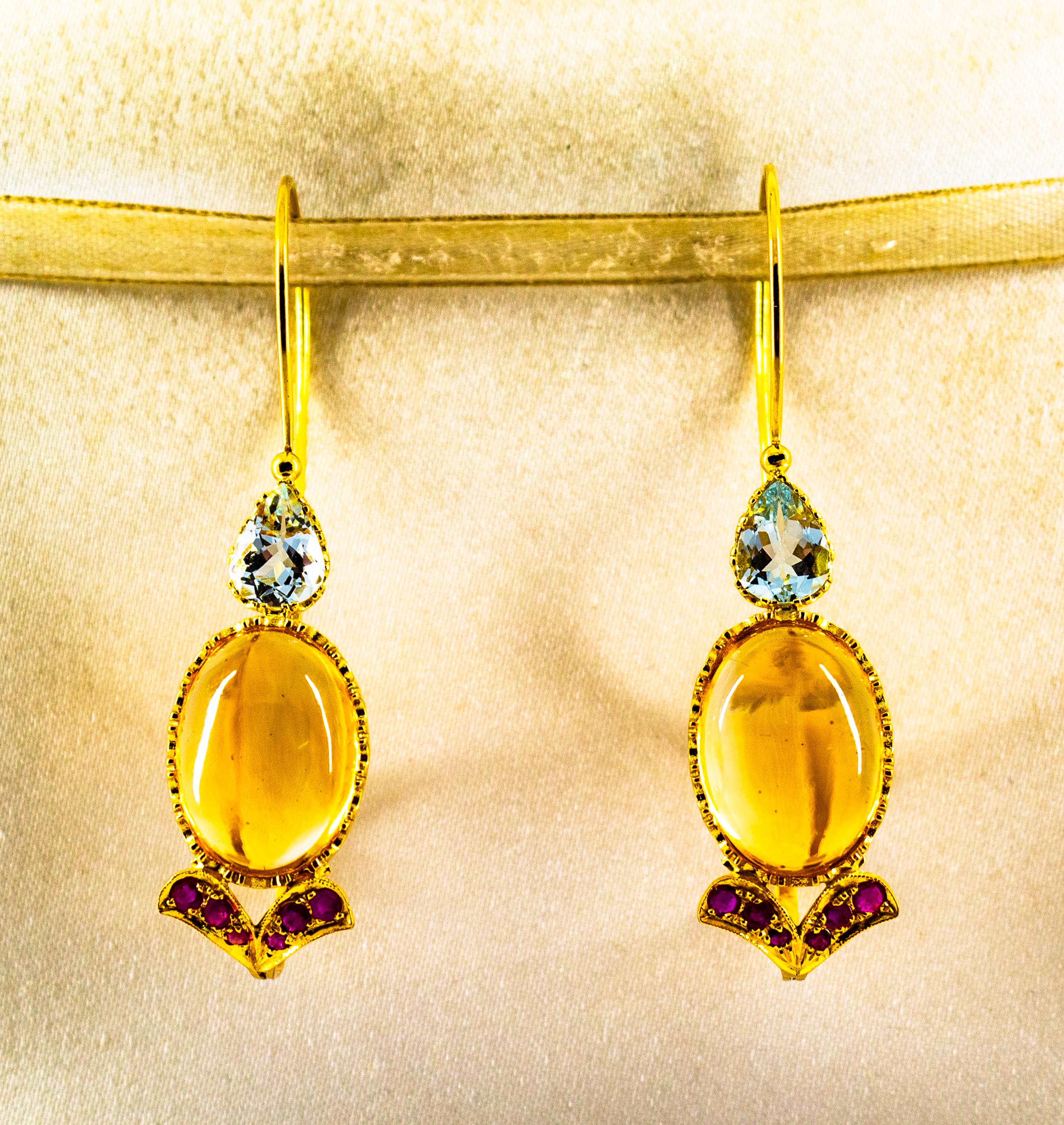These Earrings are made of 9K Yellow Gold.
These Earrings have 0.32 Carats of Rubies.
These Earrings have 2.80 Carats of Aquamarines.
These Earrings have 12.25 Carats of Cabochon Cut Citrine.
These Earrings are inspired by Art Nouveau.
All our