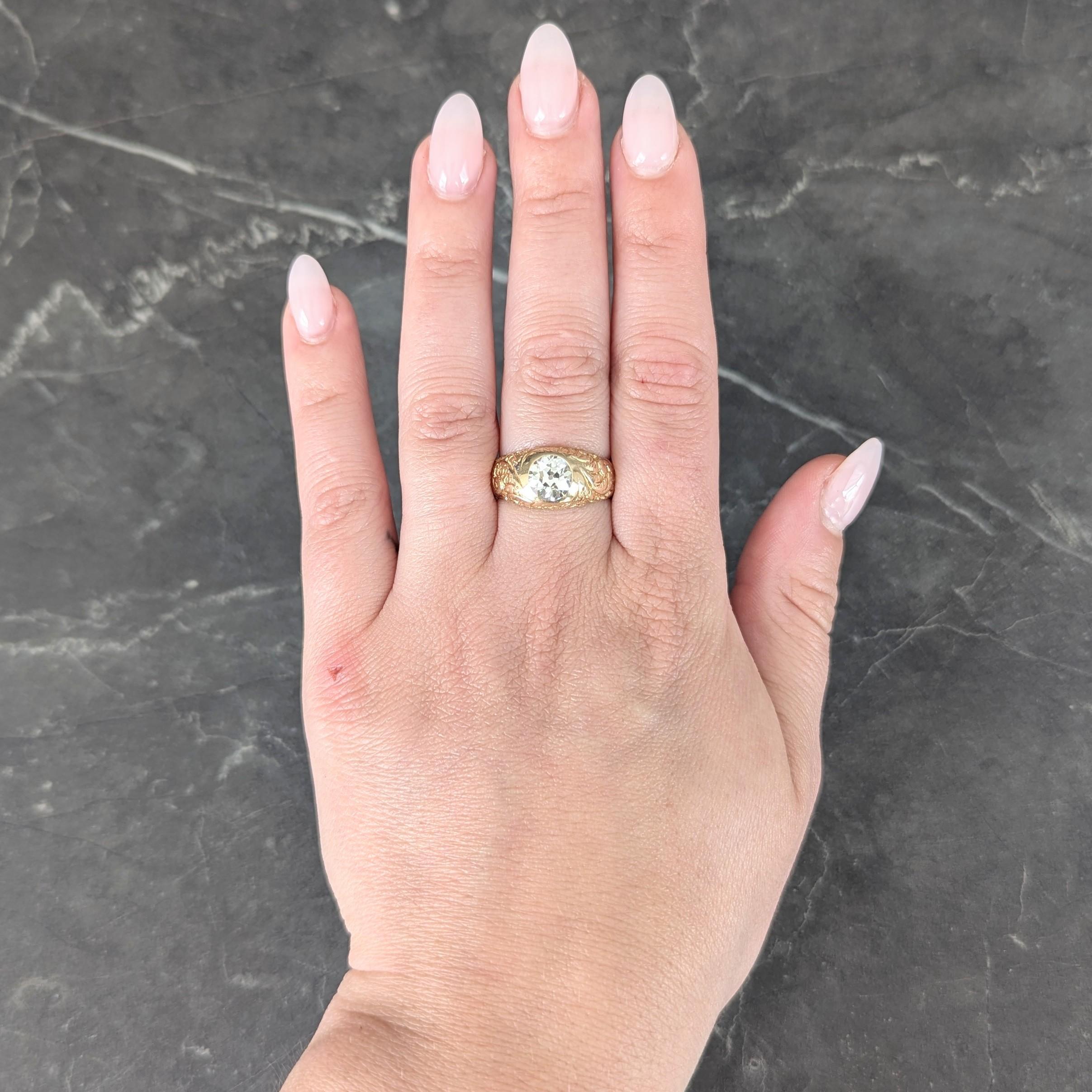 Centering an old mine cut diamond weighing approximately 1.60 carats
K color with SI1 clarity - flush set in a bombé shaped surround
Engraved with ornate scrolling fiddlehead fern motif
Inscribed 'D.P.'
Tested as 14 karat gold
Circa: 1905
Ring Size: