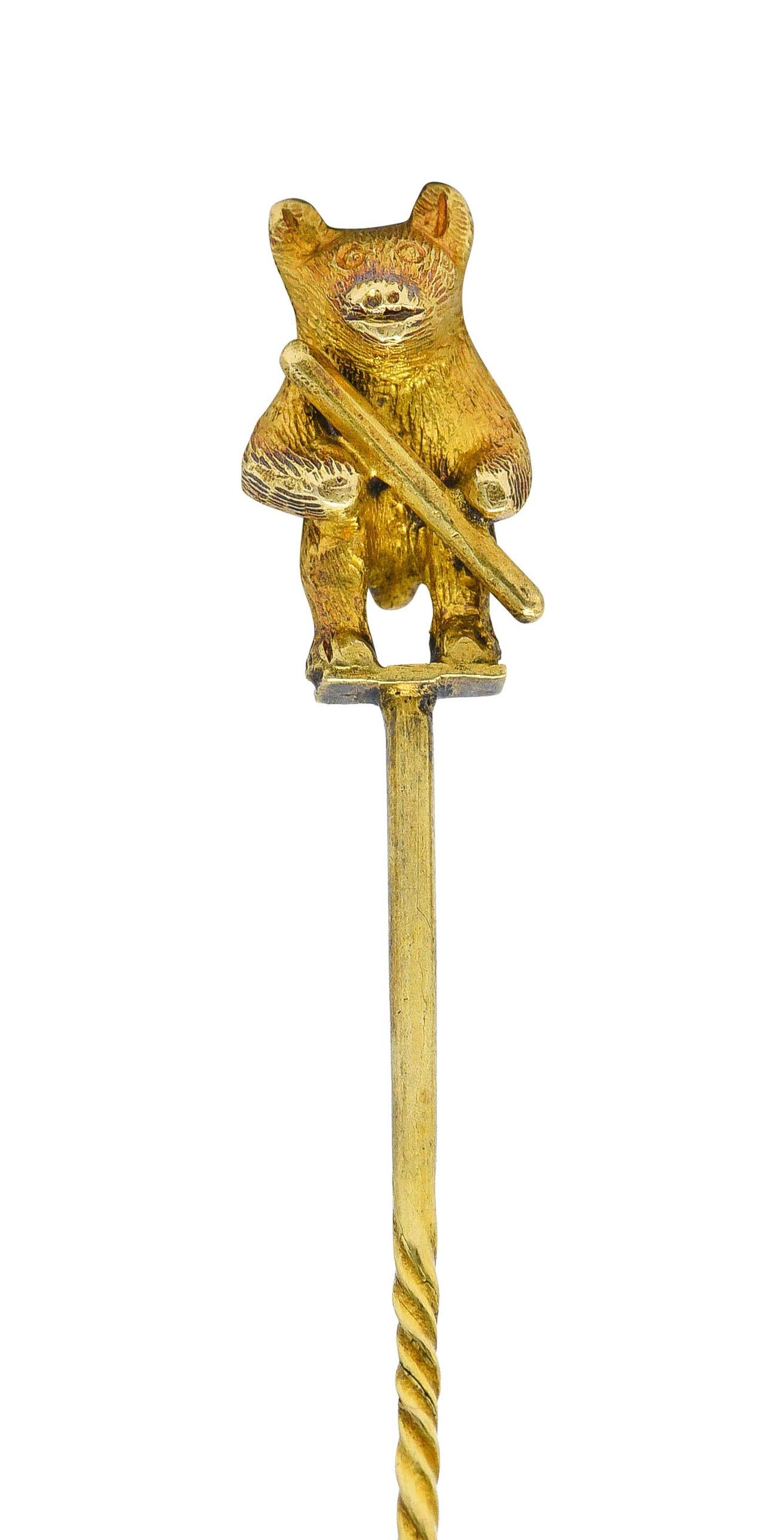 Depicting a stylized bear standing on its hind legs while grasping a branch

With highly textured fur

Bear tested as 18 karat gold while pin stem is 14 karat gold

Circa: 1905

Bear measures: 5/16 x 9/16 inch

Total length: 2 1/2 inches

Total