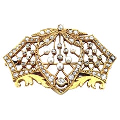 Spilla Art Nouveau con diamanti e perle in 18 carati