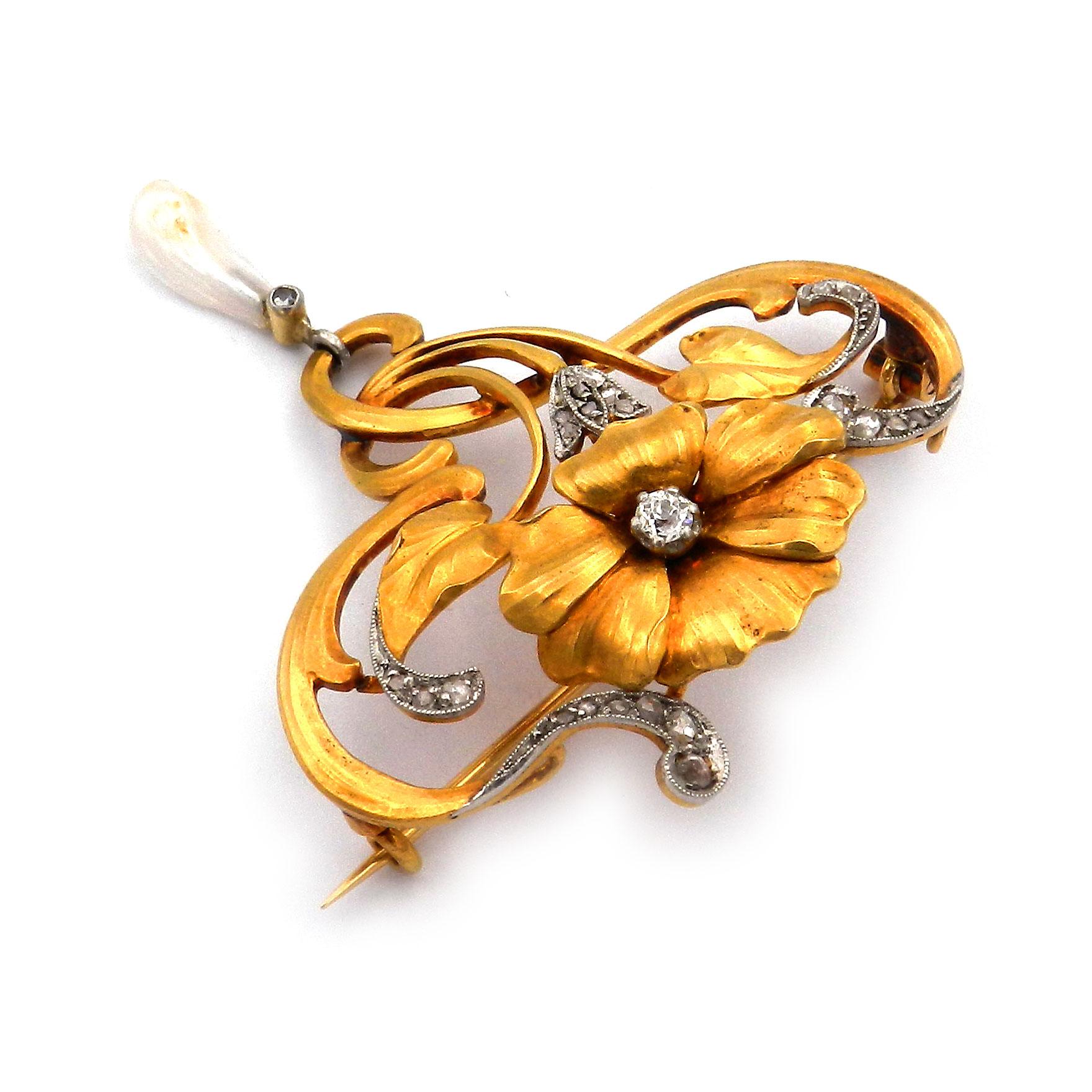 Art Nouveau 18K Gold Diamond and Oriental Pearl Brooch, circa 1905

This elegant gold brooch is created around 1900 and is made from 18k/750 yellow gold. It is sculpturally designed in the form of a very finely crafted flower, set with an old-cut