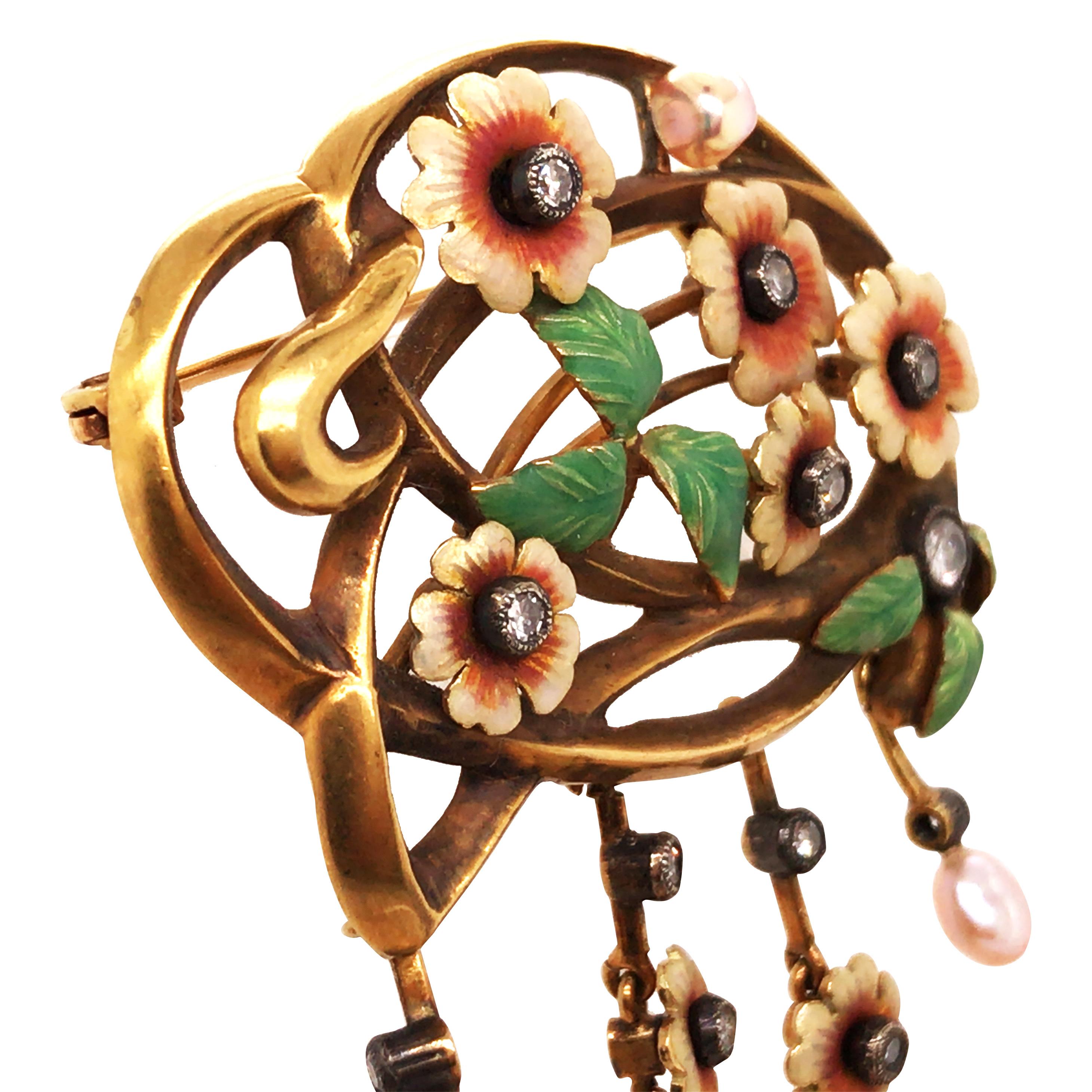 Art Nouveau brooch with diamonds total approx. 0.25ct, cultured pearls, 18K yellow gold, settings silver. Flowers and leaves with colored enamel, 4 flower tendrils, circa 1900, with case.

Weight: 18.2 grams
Measurement: 7 x 4 cm