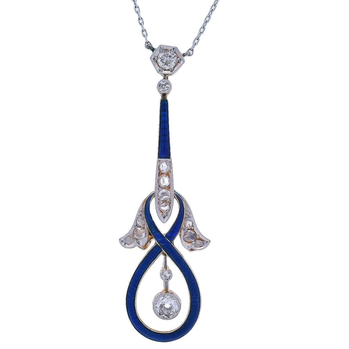 Circa 1900s, this exquisite pendant necklace is crafted in 18kt yellow Gold and Platinum on top. The centerpiece features two Old mine Diamonds weighing approximately 0.25 carats, with an H-J color and SI clarity. Complementing the diamonds are nine
