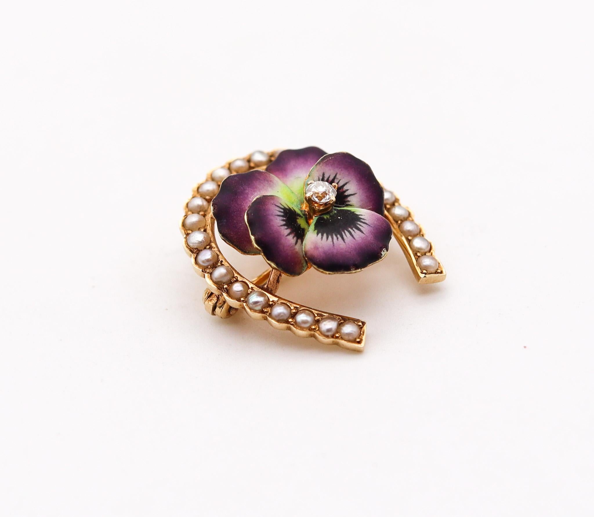 Edwardian enameled purple flower brooch.

Very beautiful three-dimensional piece, created in America during the Edwardian and the Art Nouveau periods, between the 1901 and1910. This beautiful pin brooch has been carefully crafted in the shape of a