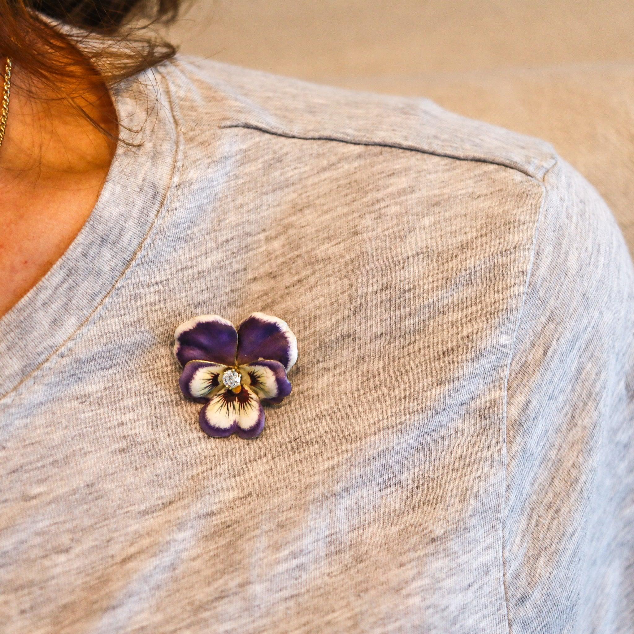 Art nouveau enameled flower pendant-brooch.

This is a beautiful pendant-brooch, created in America during the Art Nouveau period, back in the 1905. This brooch has been designed in the shape of a pansy flower of five-petals and was carefully
