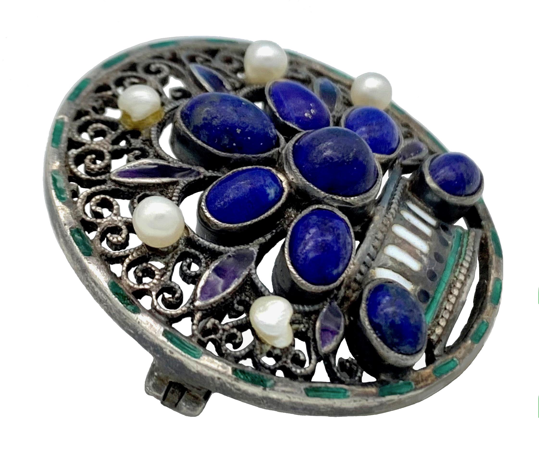  This brooch is identical to the one published in the catalogue accompaning the exhibition  'Schmuck zwischen Avantgarde und Tradition' on page 134, no 1.18a published by the Arnoldsche Verlagsanstalt, 1990. The published Brooch is in the