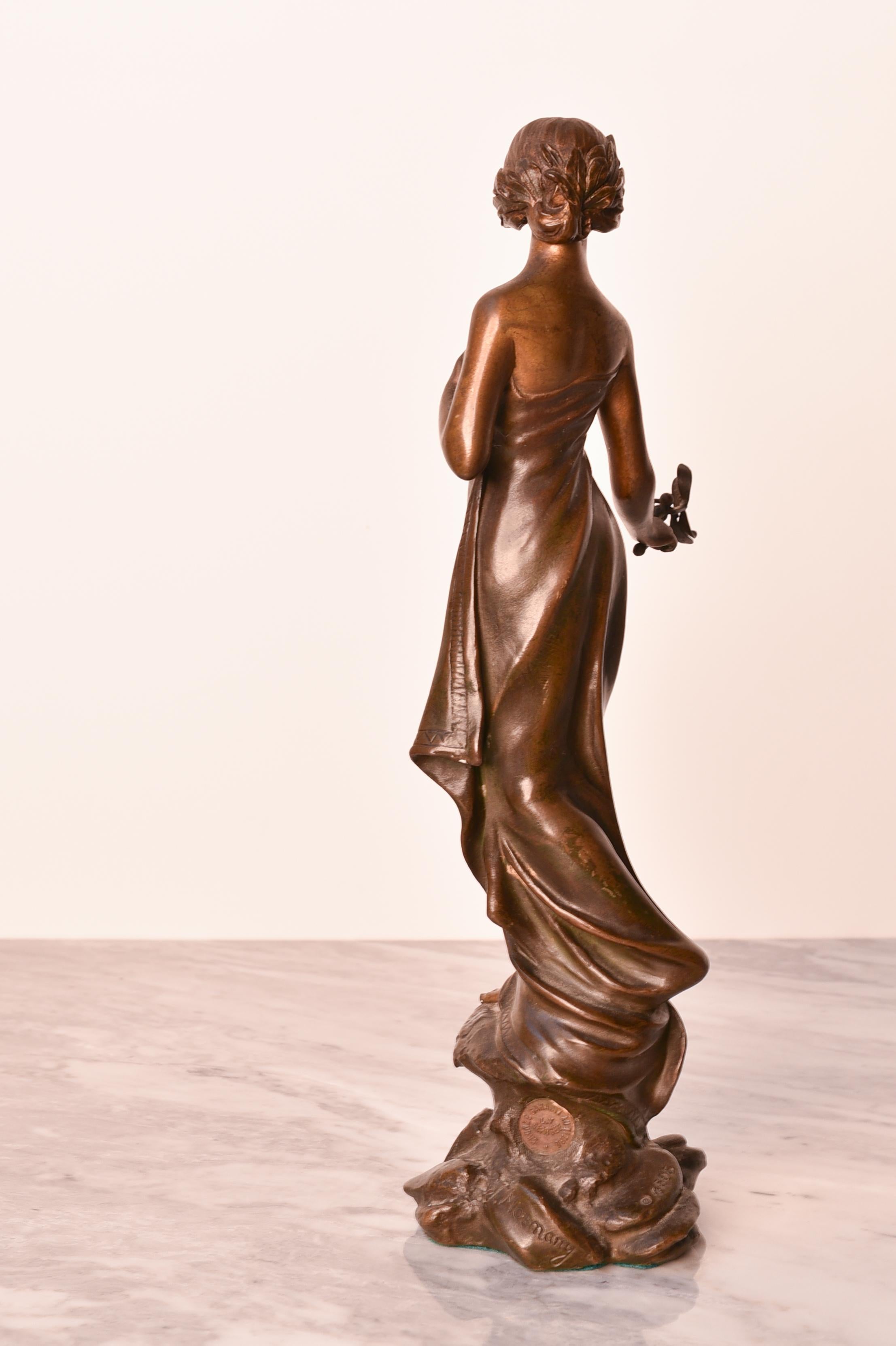 French Art Nouveau 19th century bronze statue of woman holding a mistletoe, by Monmany For Sale