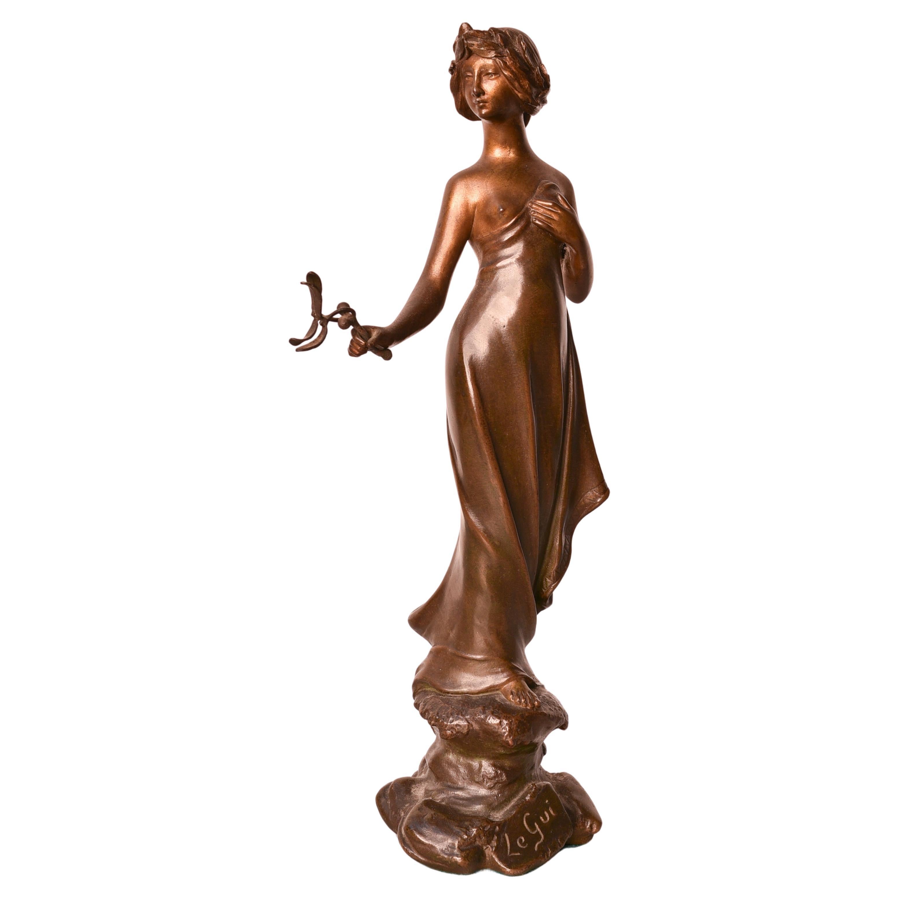 Art Nouveau 19th century bronze statue of woman holding a mistletoe, by Monmany For Sale