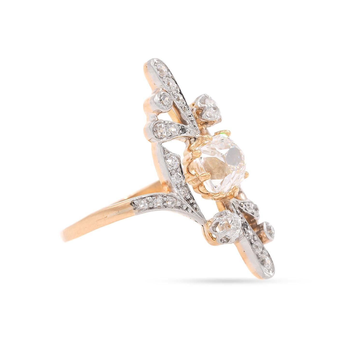 A Unique Antique Art Nouveau era 2.00 Carat Old Mine Cut ('Peruzzi') Diamond Engagement Ring composed of platinum & 18k yellow gold. GIA certified center stone, graded G color & VS1 clarity. With an additional 30 diamonds in the ornate setting with