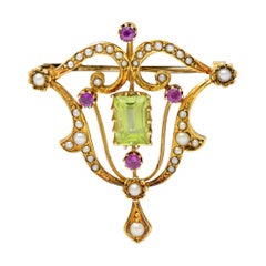 Art Nouveau 2.95 Carats Peridot Ruby Pearl 15 Karat Gold Pendant Brooch