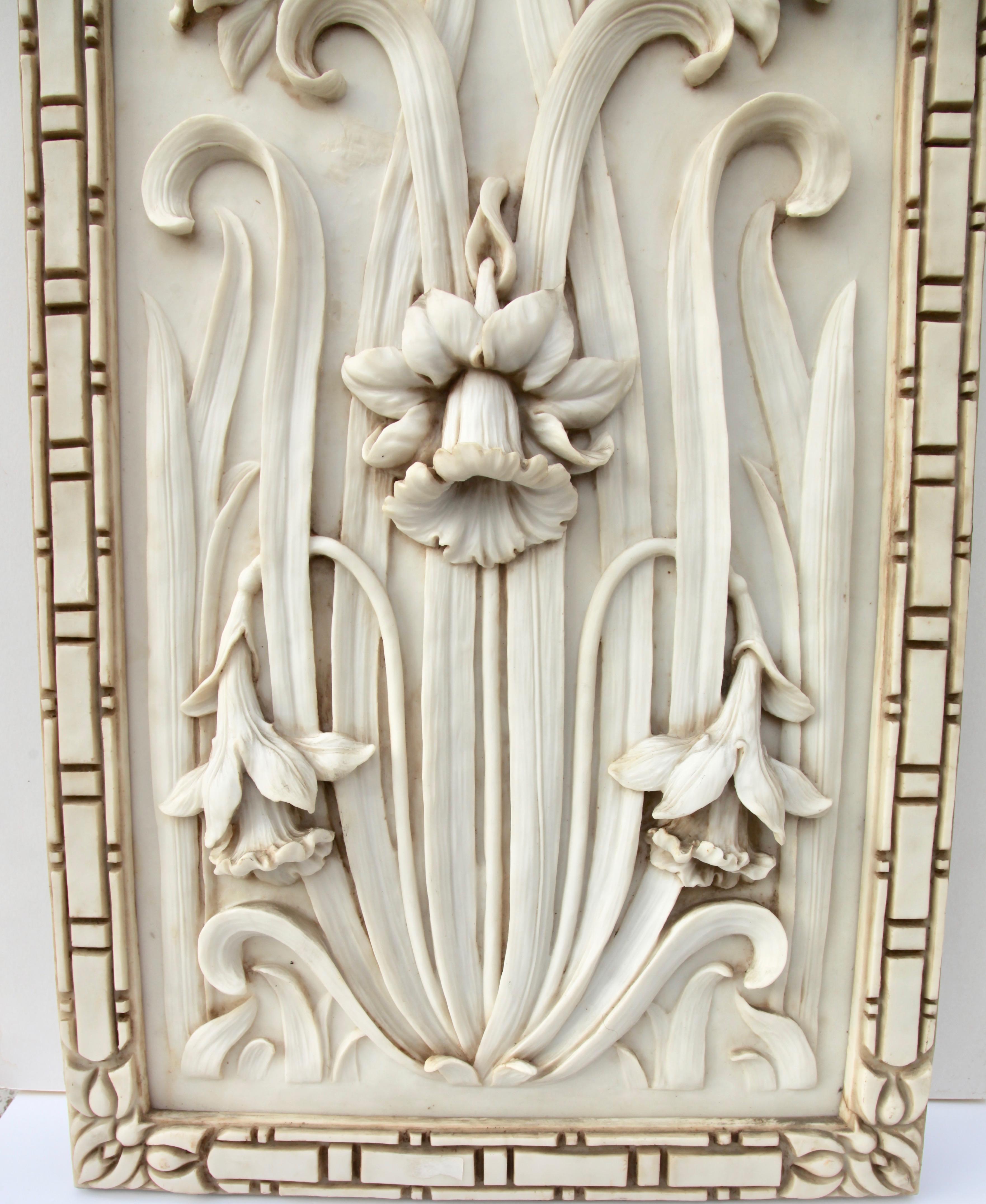 Large decorative alabaster panel with Art Nouveau design. Dramatic high-relief sculpture of daffodils (Jonquils) with leaves and flower heads in 3-D. Such items were typically used as decorative panels in the home. The alabaster has a light cream