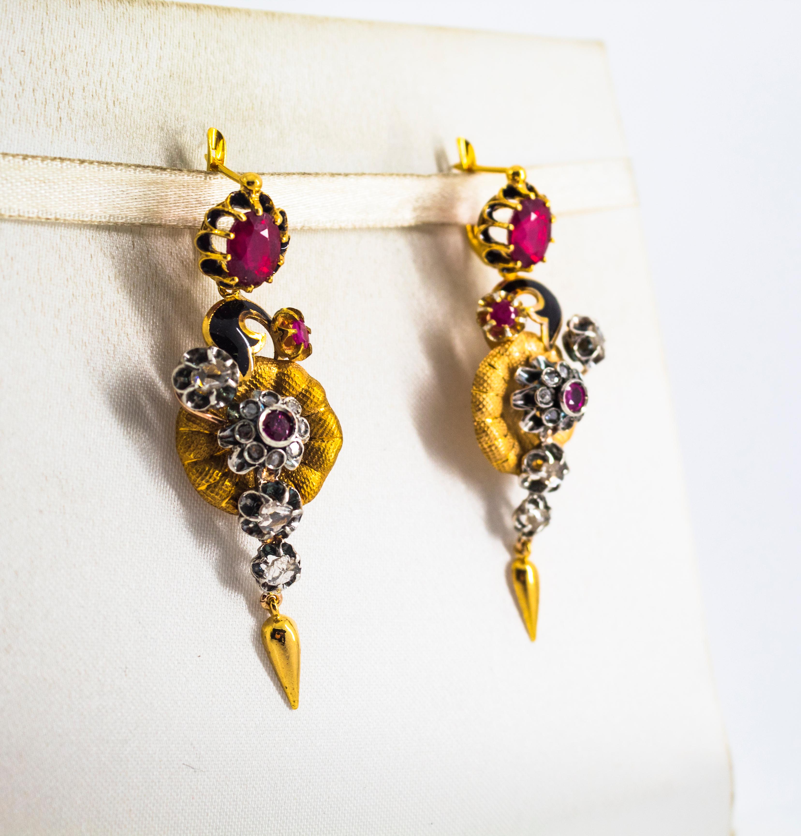 These Lever-Back Earrings are made of 9K Yellow Gold and Sterling Silver.
These Earrings have 1.10 Carats of White Rose Cut Diamonds.
These Earrings have 3.00 Carats of Rubies.
These Earrings have also Black Enamel.
All our Earrings have pins for