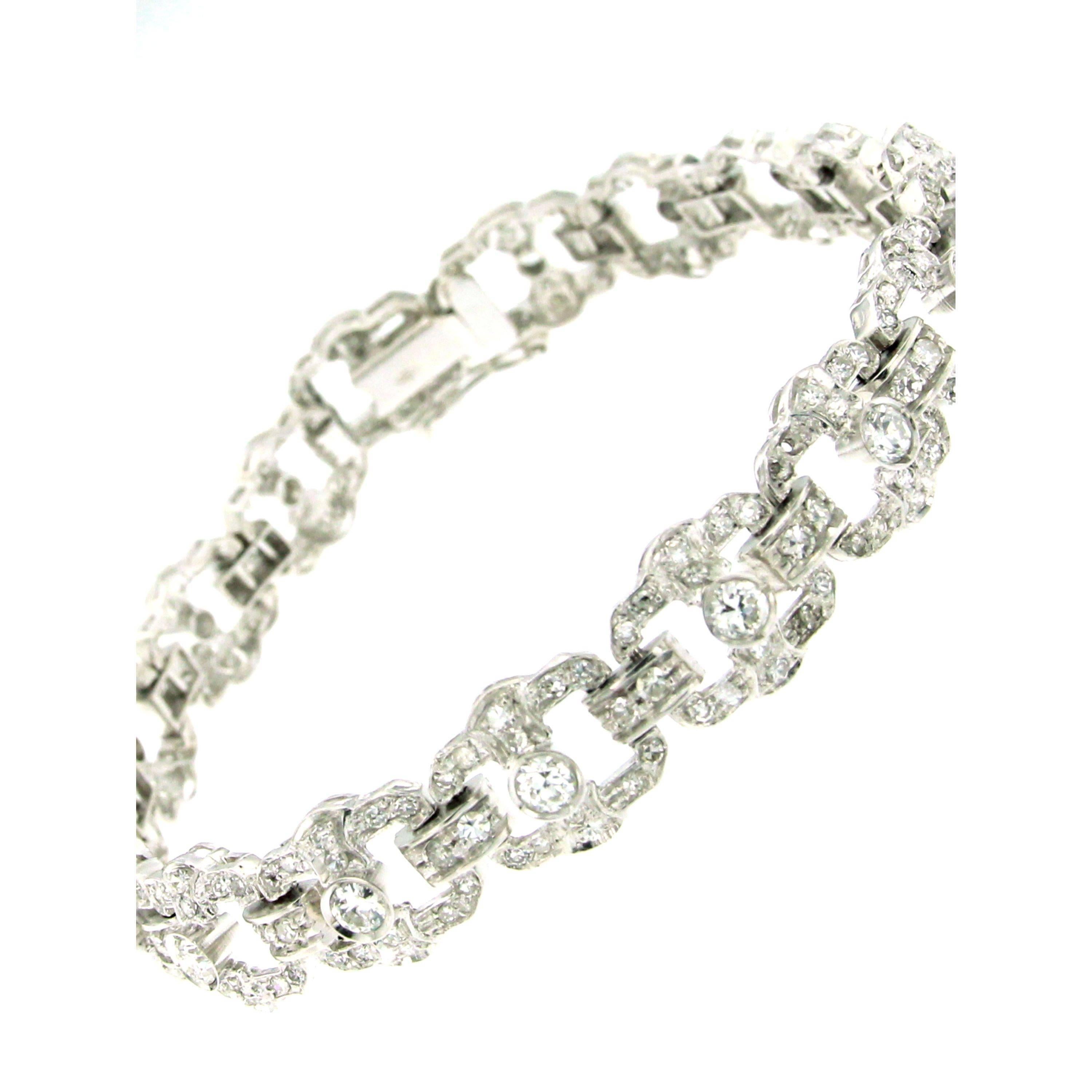 This awesome hand made 18k white gold bracelet is set with sparkling European cut Diamonds and huit huit diamonds weighing 5.00 ct. all together graded H color, Vvs clarity.

The bracelet measures 18 cm lenght, 1 cm width and secures with a hidden