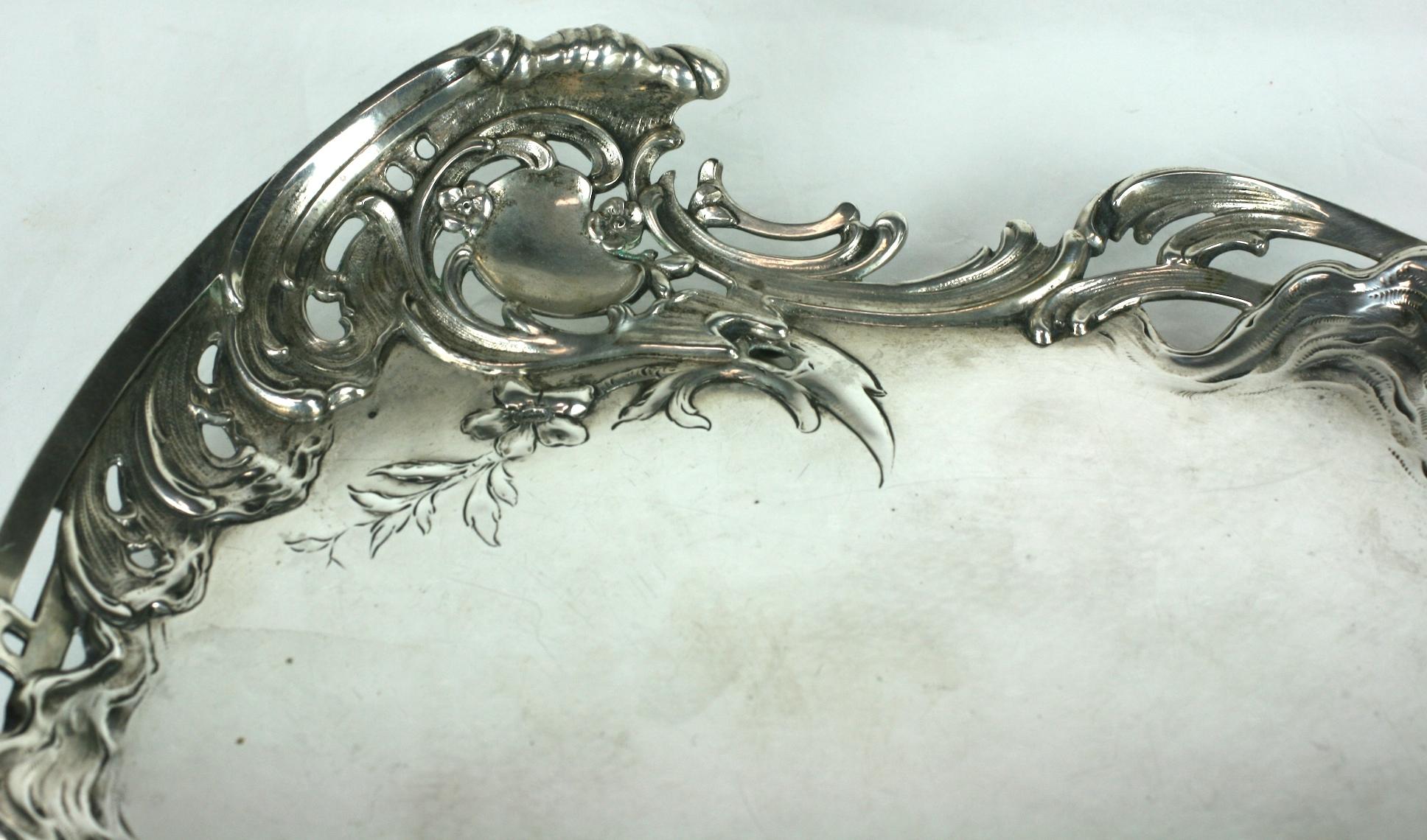 Art Nouveau 800 silver card tray with a wonderful design of realistic waves crashing against an openwork fence motif with a central wave or cartouche. Heavy quality 800 silver, beautiful detailing on 4 matching feet.
In the period, likely used for