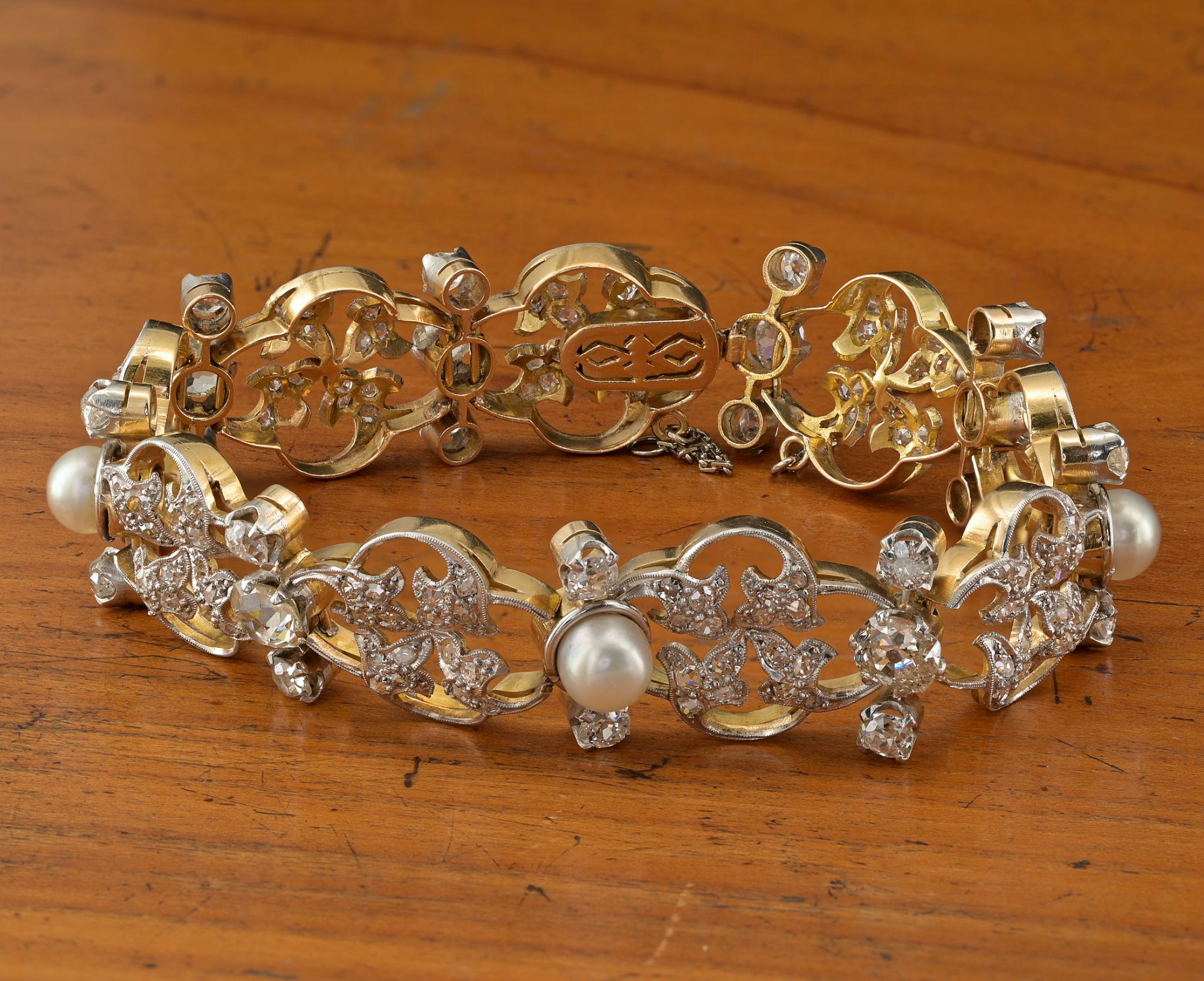 This outstanding Art Nouveau barcelet is 1900 ca
Superb past workmanship rendered of solid 18 KT gold Platinum topped
Fine design of leaf work expressed in sinuos curvilinear lines richly set with opulence of Diamonds and natural pearls
Fully