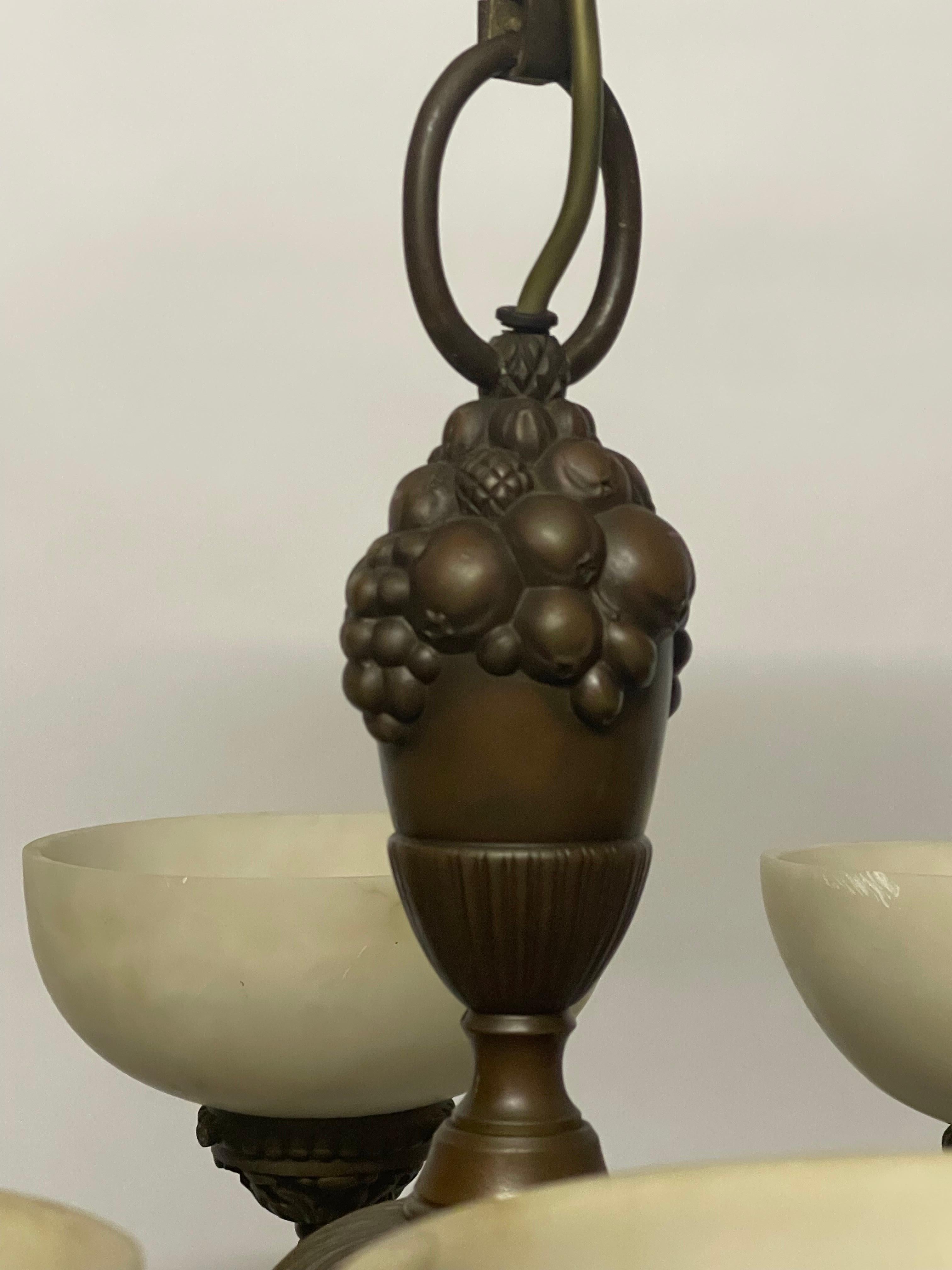 Art Nouveau Alabaster and Bronze Chandelier with Heads and Fruits, circa 1910s In Good Condition In Wiesbaden, Hessen