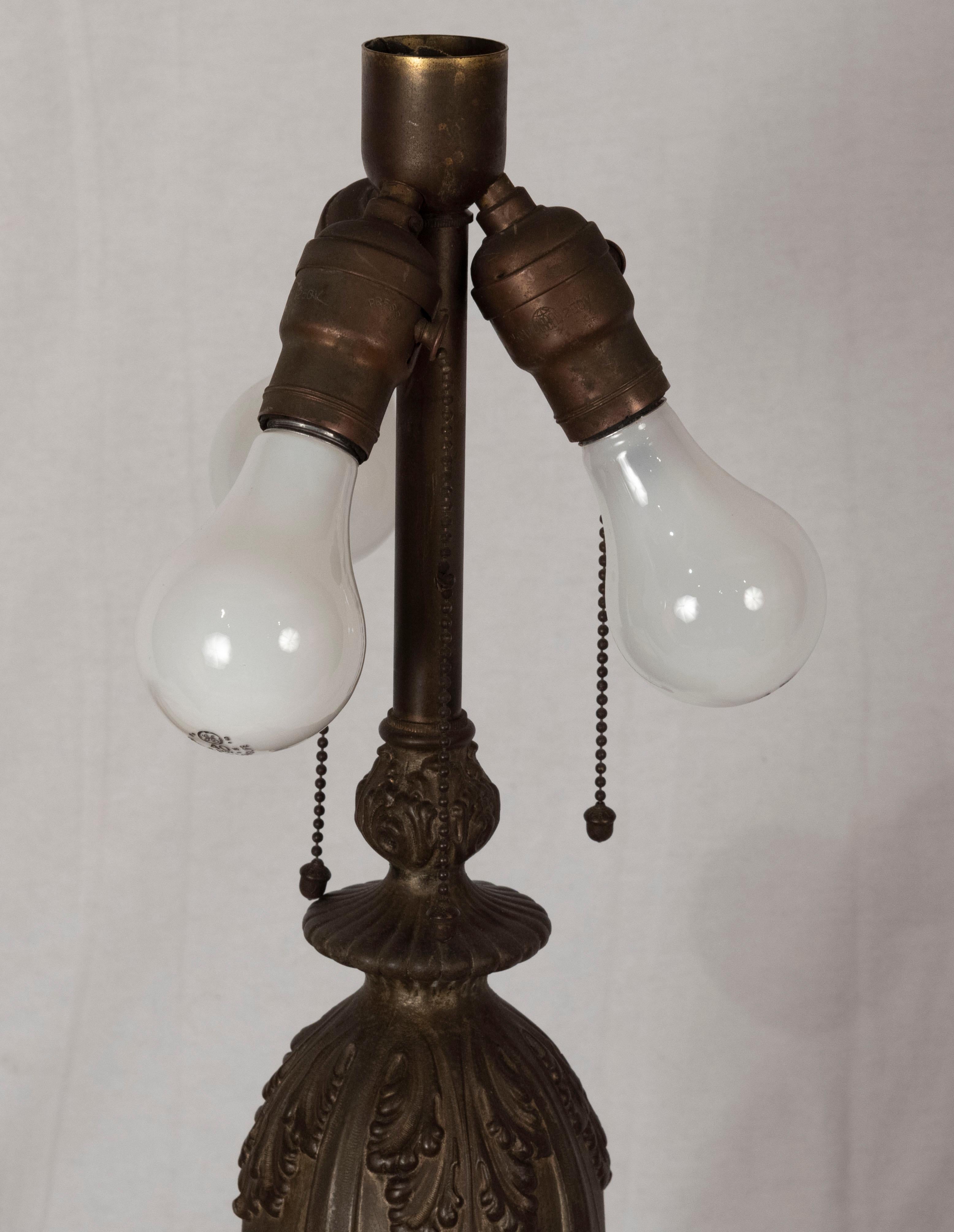 Art Nouveau American slag glass lamp with etched shade, (circa 1900),

United States

Measures: 26.5 x 22 diameter in.