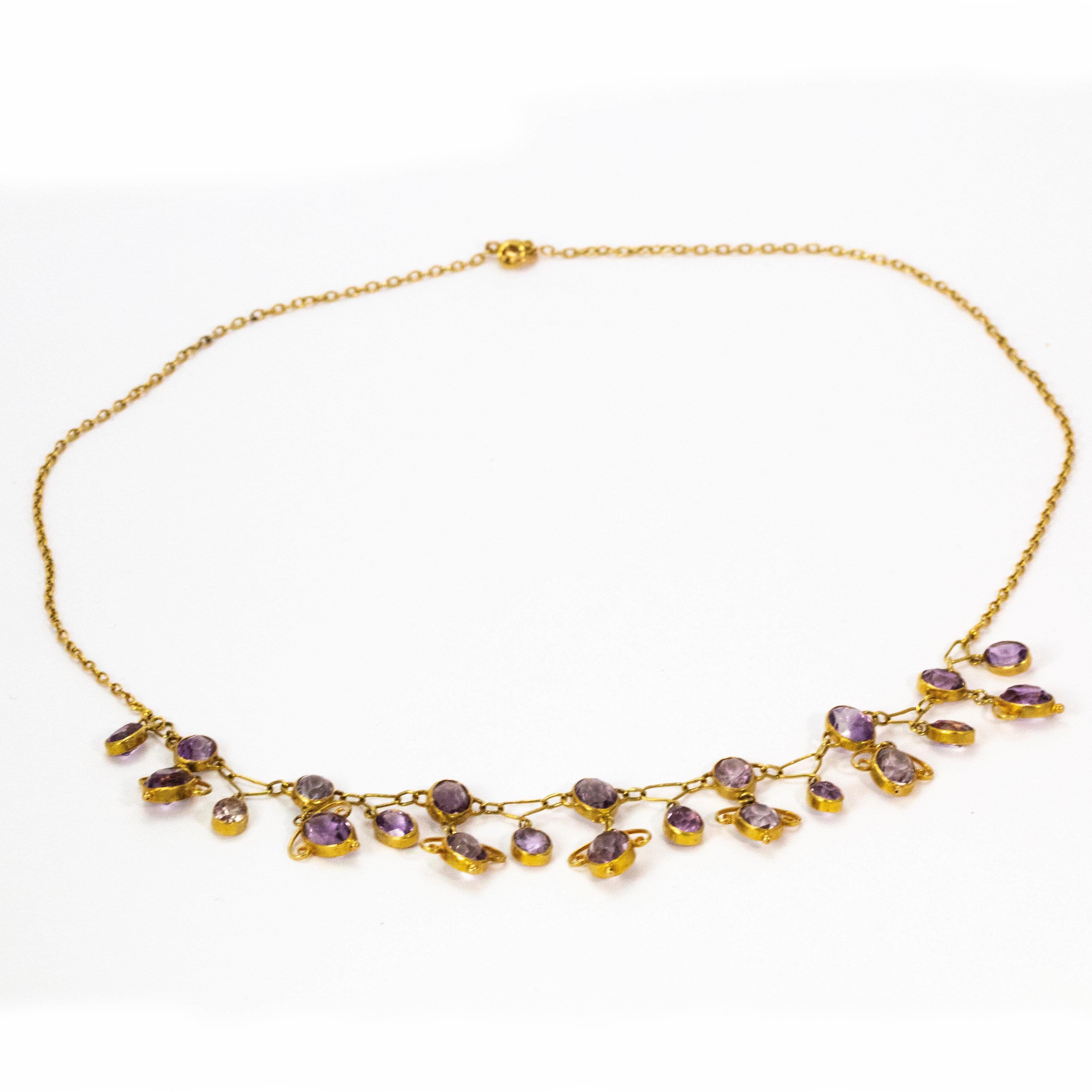 A spectacular Art Nouveau necklace by Liberty & Co. circa 1910. Set with wonderful double and single amethyst drops all in fine ornate settings. Modelled in 15 karat yellow gold.

Chain Length: 42cm