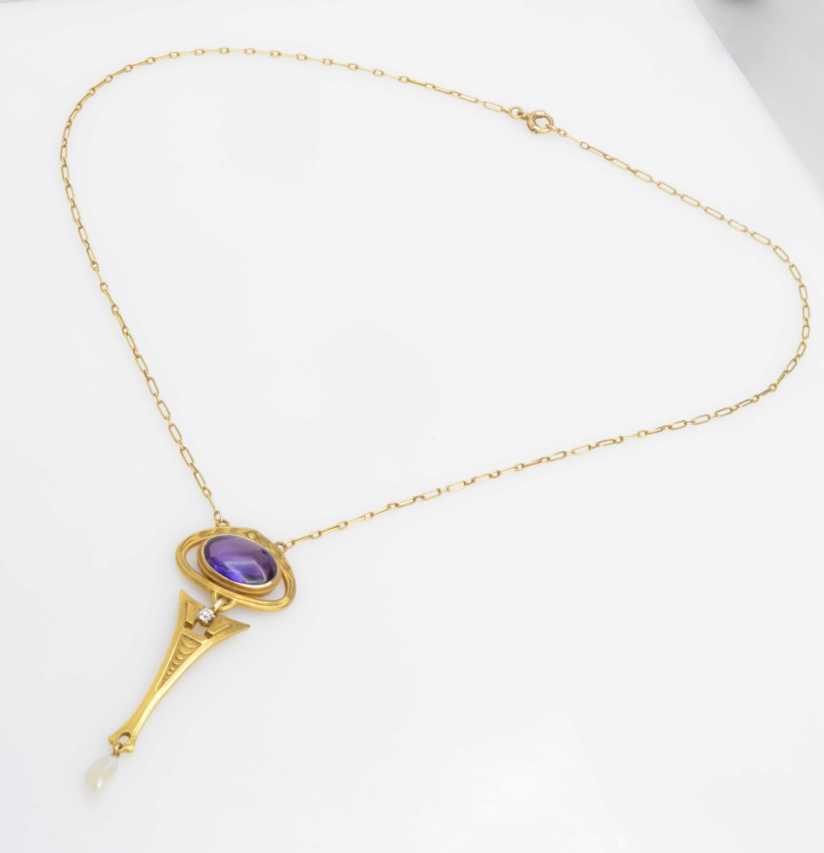 This beautiful & delicate necklace is a lovely example of the Art Nouveau period.This whimsical period in French history only lasted a short 20 years but made quite an impact on jewelry history. The center amethyst stone is faceted on the underneath