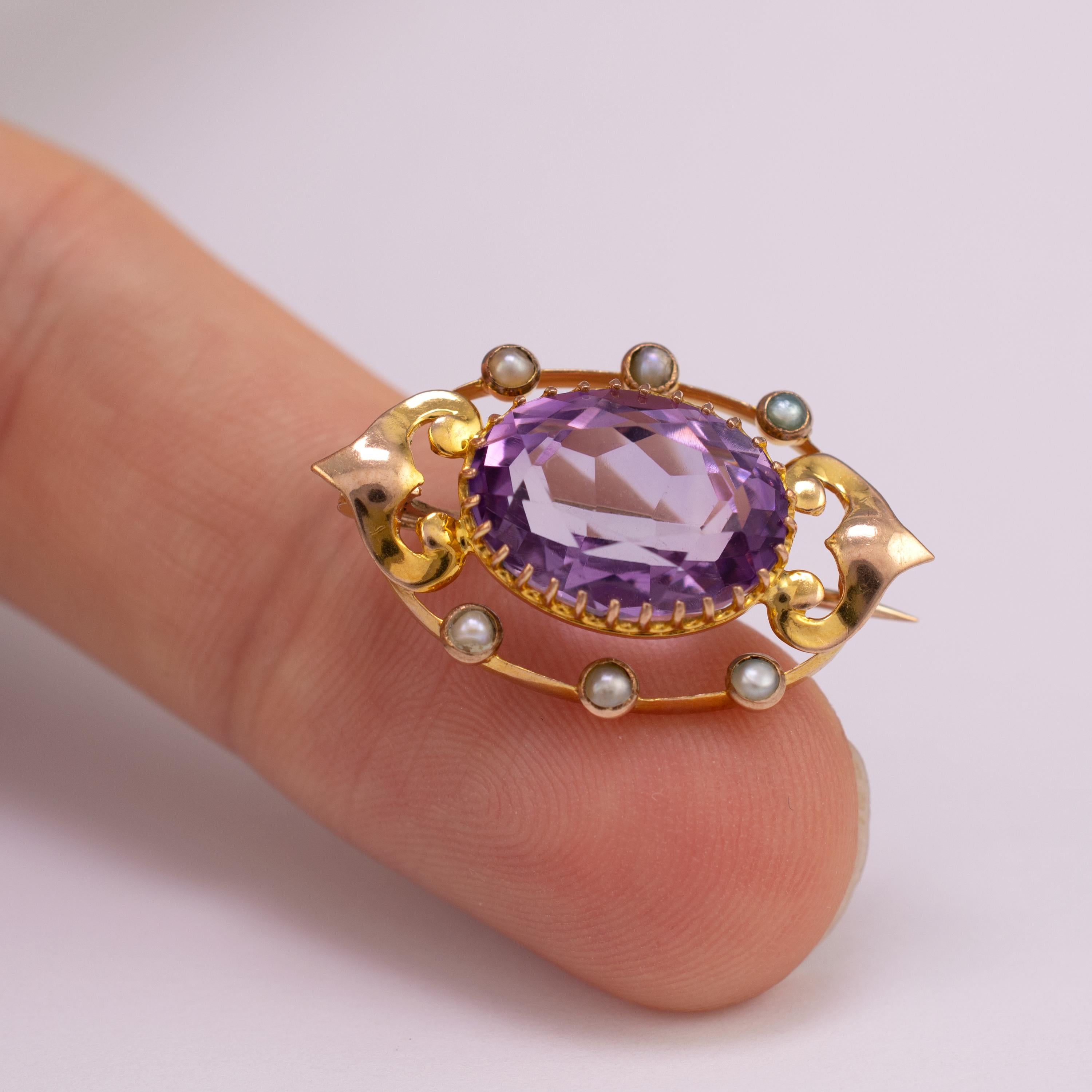 An exquisite Art Nouveau lace pin brooch with amethyst and pearls, Circa 1900

Lace pins were used in the Victorian and Edwardian periods on the collar. This example boasts an oval shape crown set pale amethyst stone of the highest quality. There