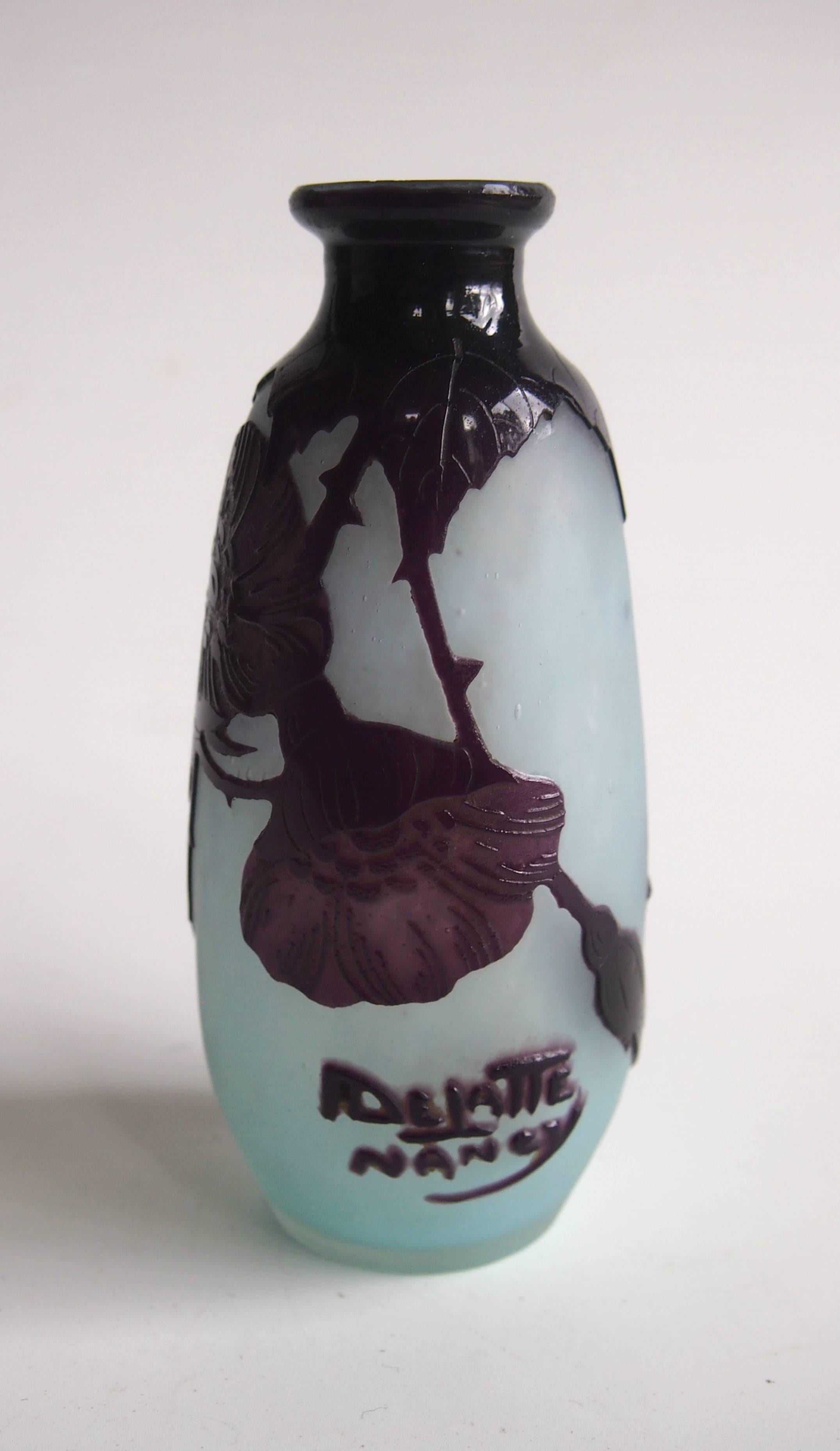 Superb Art Nouveau deep purple on pretty pale blue small cameo vase by Andre Delatte depicting flowers with prickly stems. Nicely signed in cameo see image 2

Andre Delatte was one of the best of the French cameo makers in the later Art Nouveau