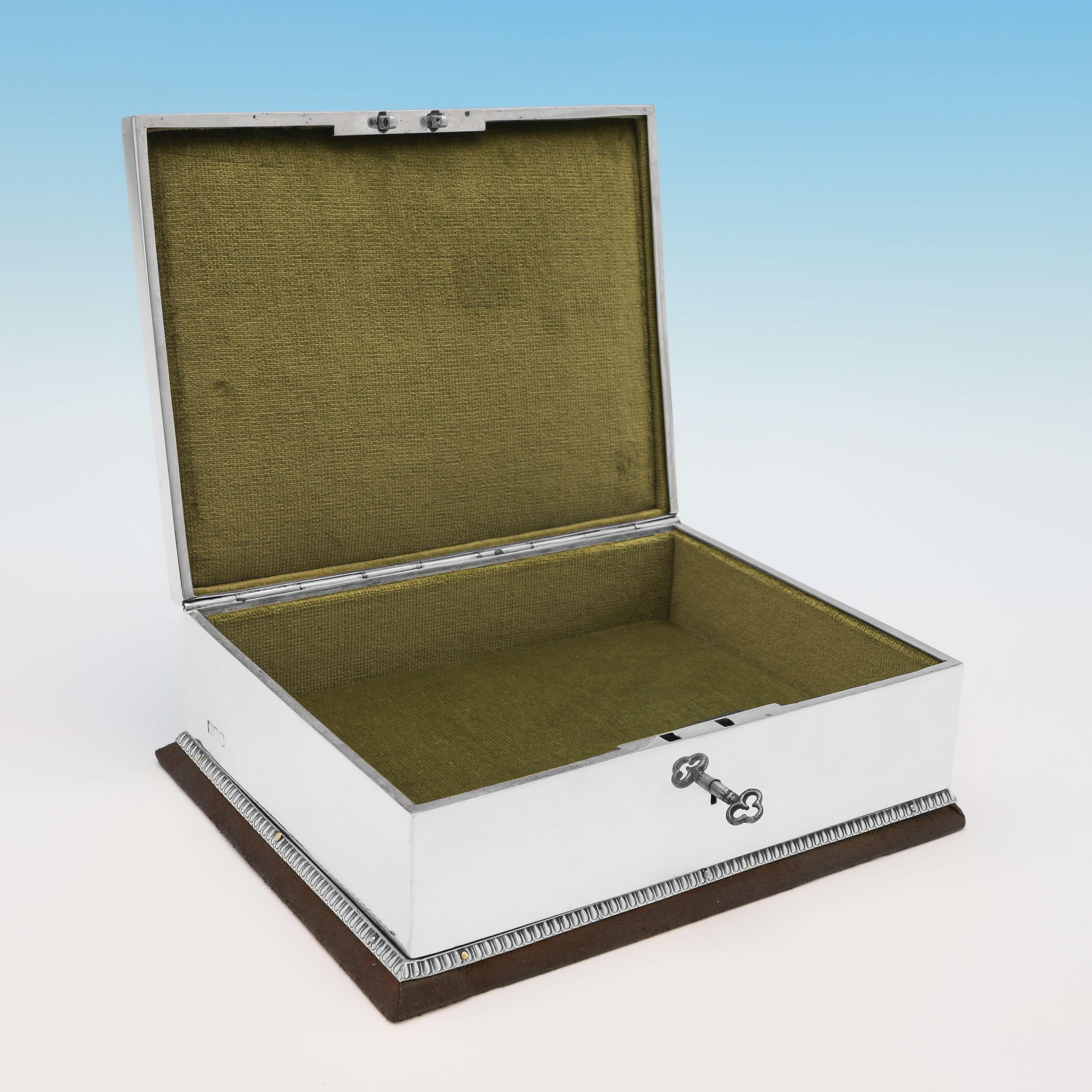 Hallmarked in London in 1908 by John Batson & Sons, this stylish, antique sterling silver Jewellery box, is in the Art Nouveau taste, with inlaid panels of moss agate to the lid, a green lined interior and presented with the original key. 

The