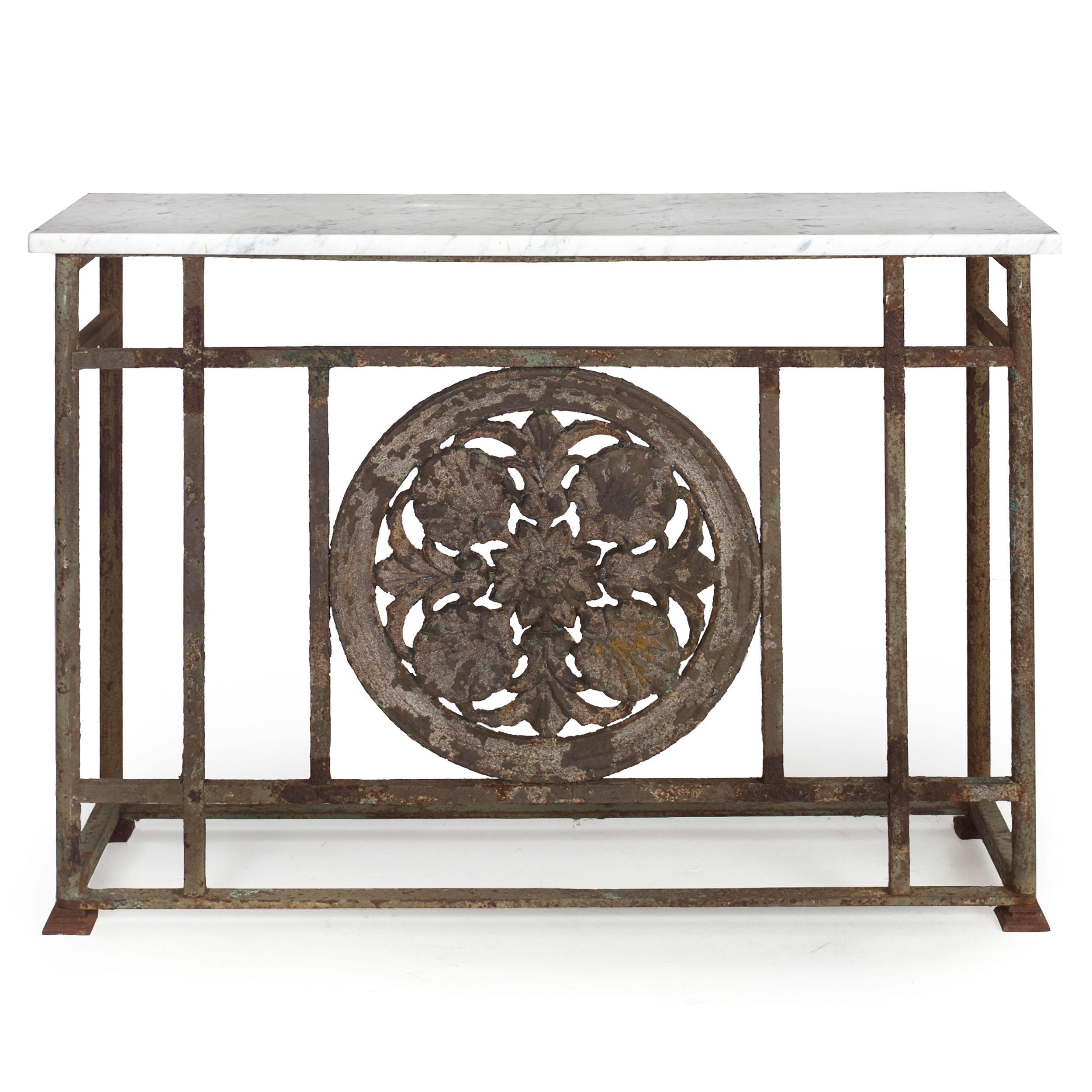 Rich with texture and chaotic color, this wonderful selection of iron-work features a crafty construction that minimizes the use of welds in favor of pinned tenon joints. An angular and austere form, the marble top is plain with squared edges and