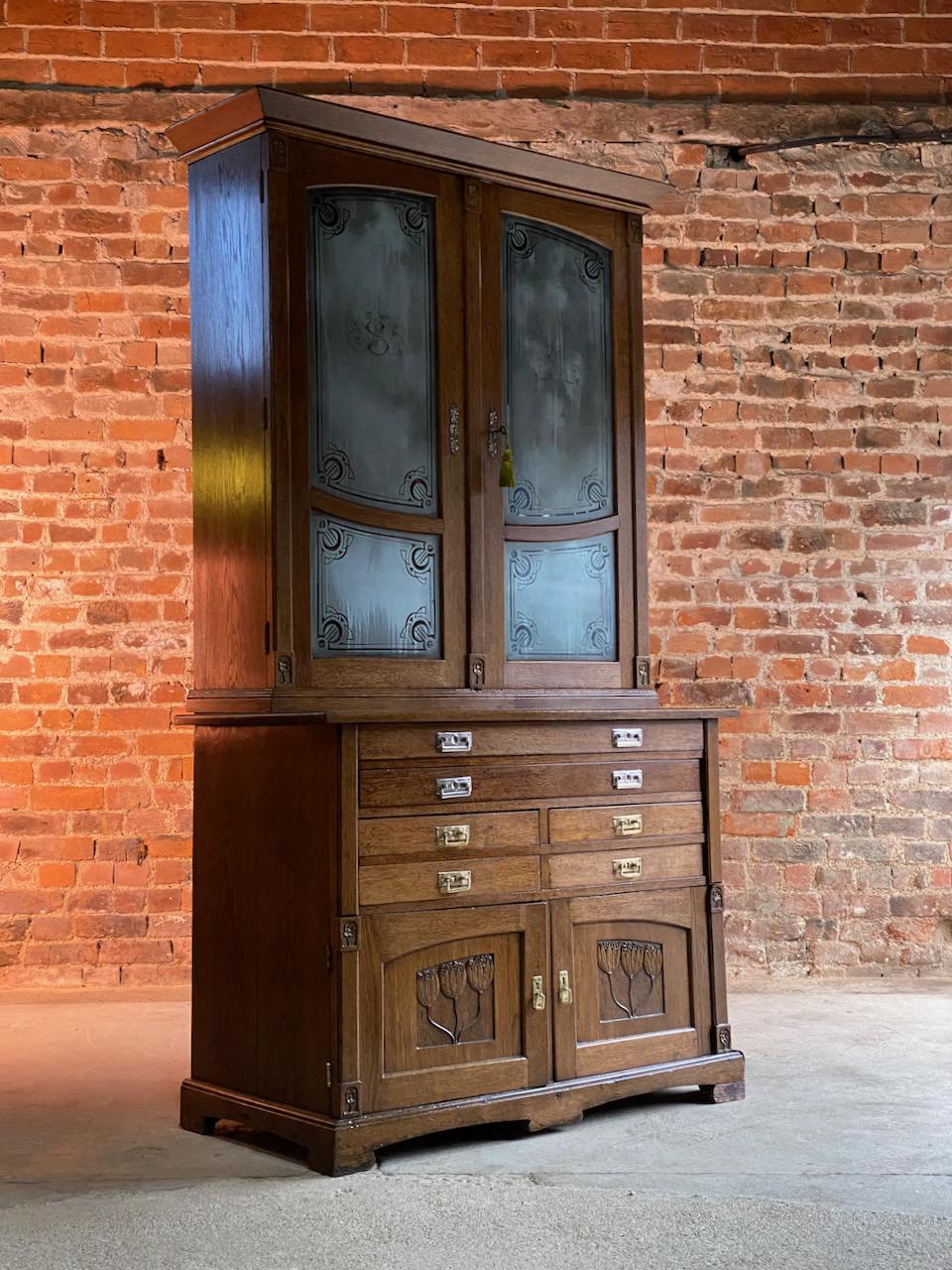 Art Nouveau Apothecary Cabinet Ukraine circa 1930s number 22

Magnificent early 20th century Ukrainian Art Nouveau apothecary oak and glass pharmacy cabinet circa 1930s, the corniced top over two etched glazed cabinet doors with Art Nouveau