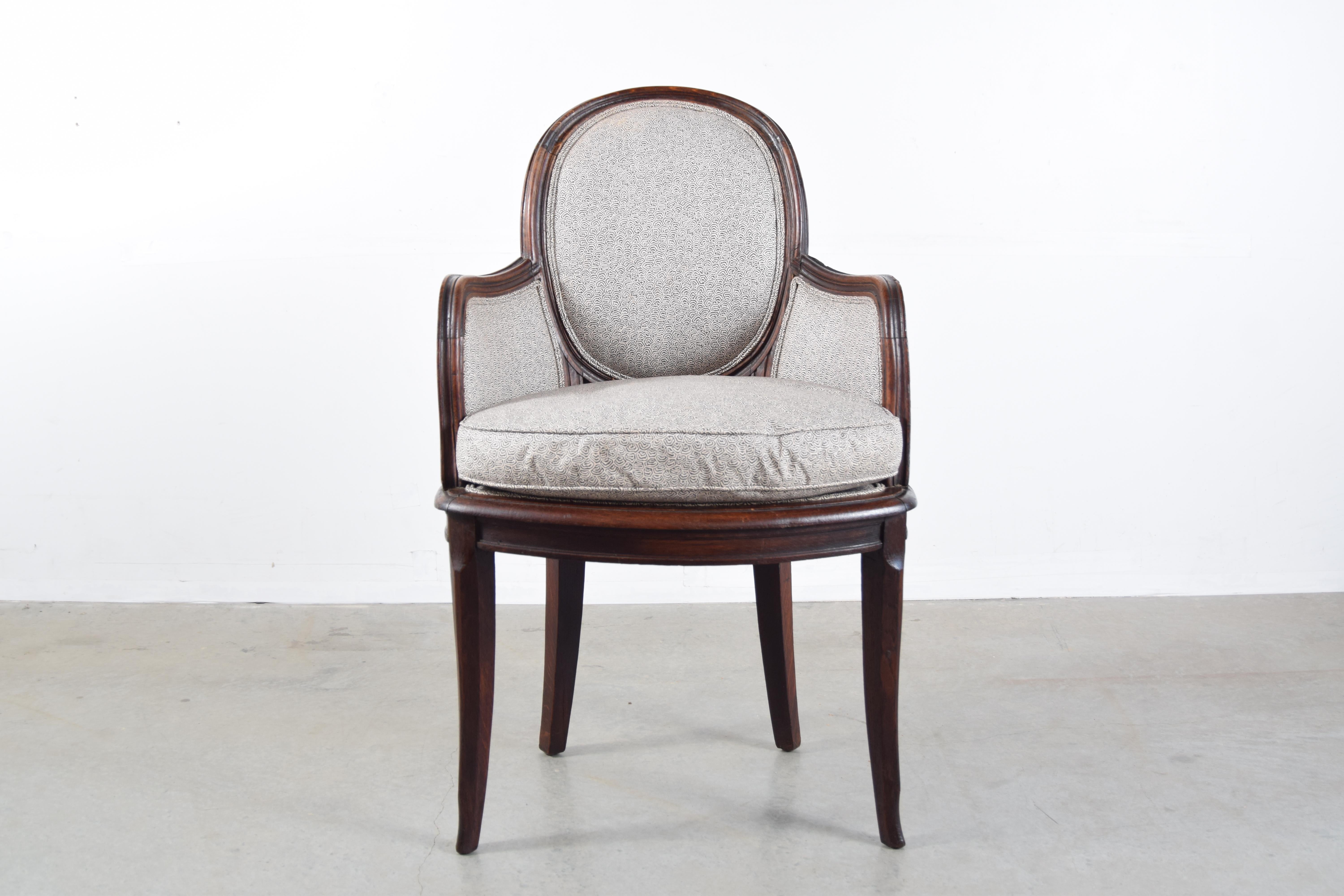 Art Nouveau armchair in oak, circa 1895 - 1910, France. Chair appears to have been re-upholstered within the past 10 years. Measures: 38 1/4